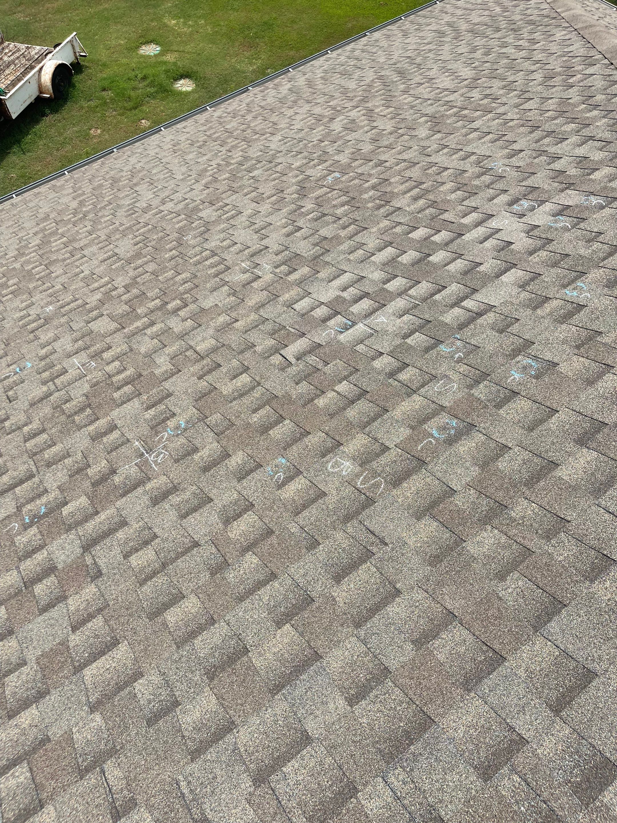 Hail Damage on a Roofing System by Icon Roofing And Construction 
