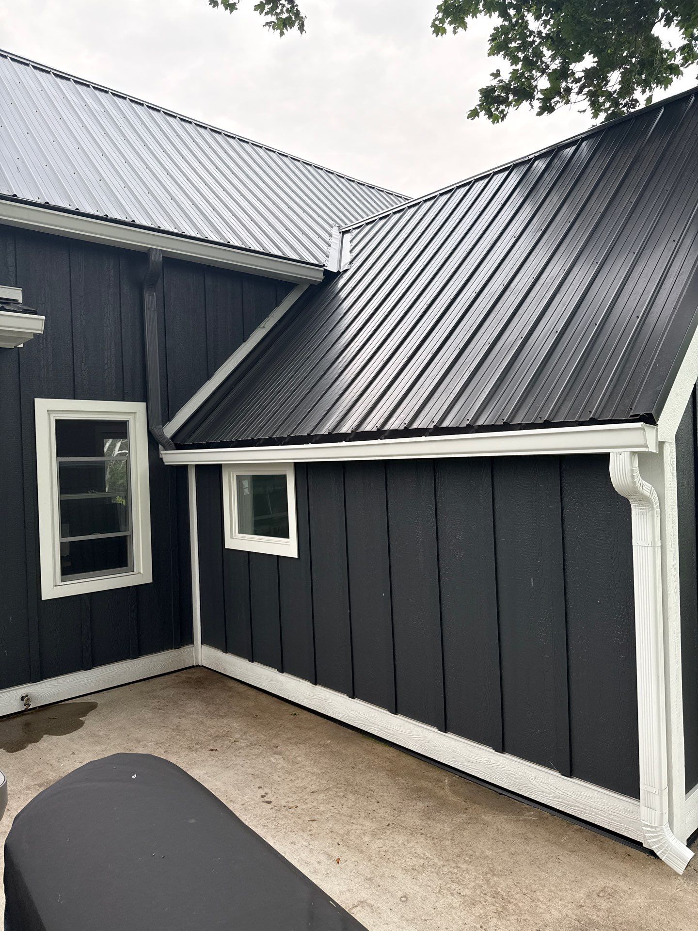 Seamless Gutter and Gutter Helmet Installation on Bellaire Metal Roof by Rainbow Seamless Systems