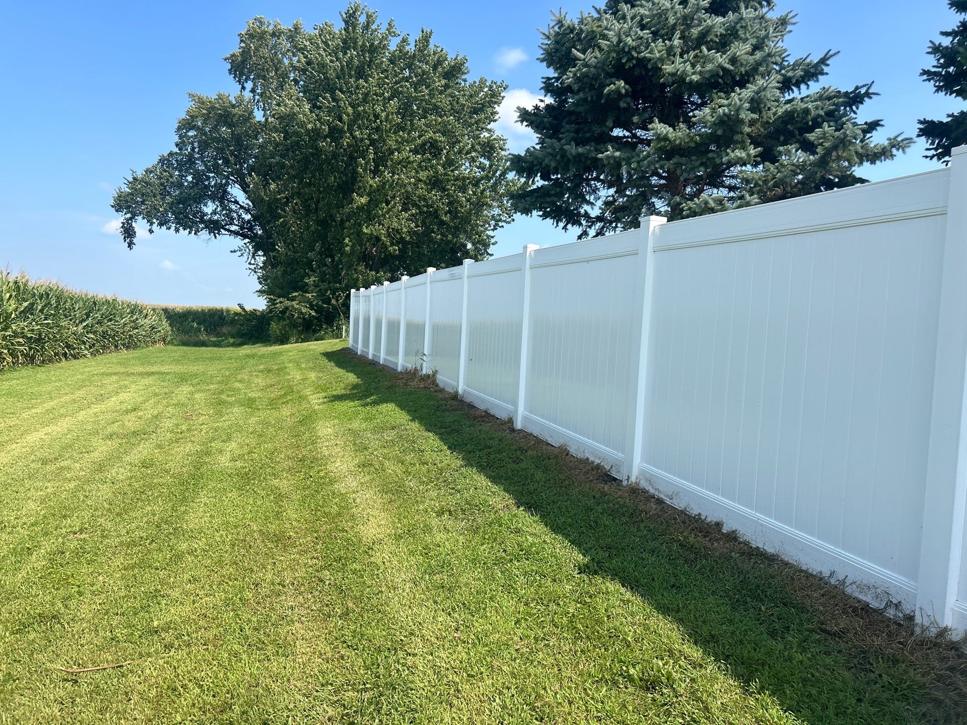 White Vinyl Privacy Fence Installation in Waterloo Iowa by Perfect Picket Fence and Stain