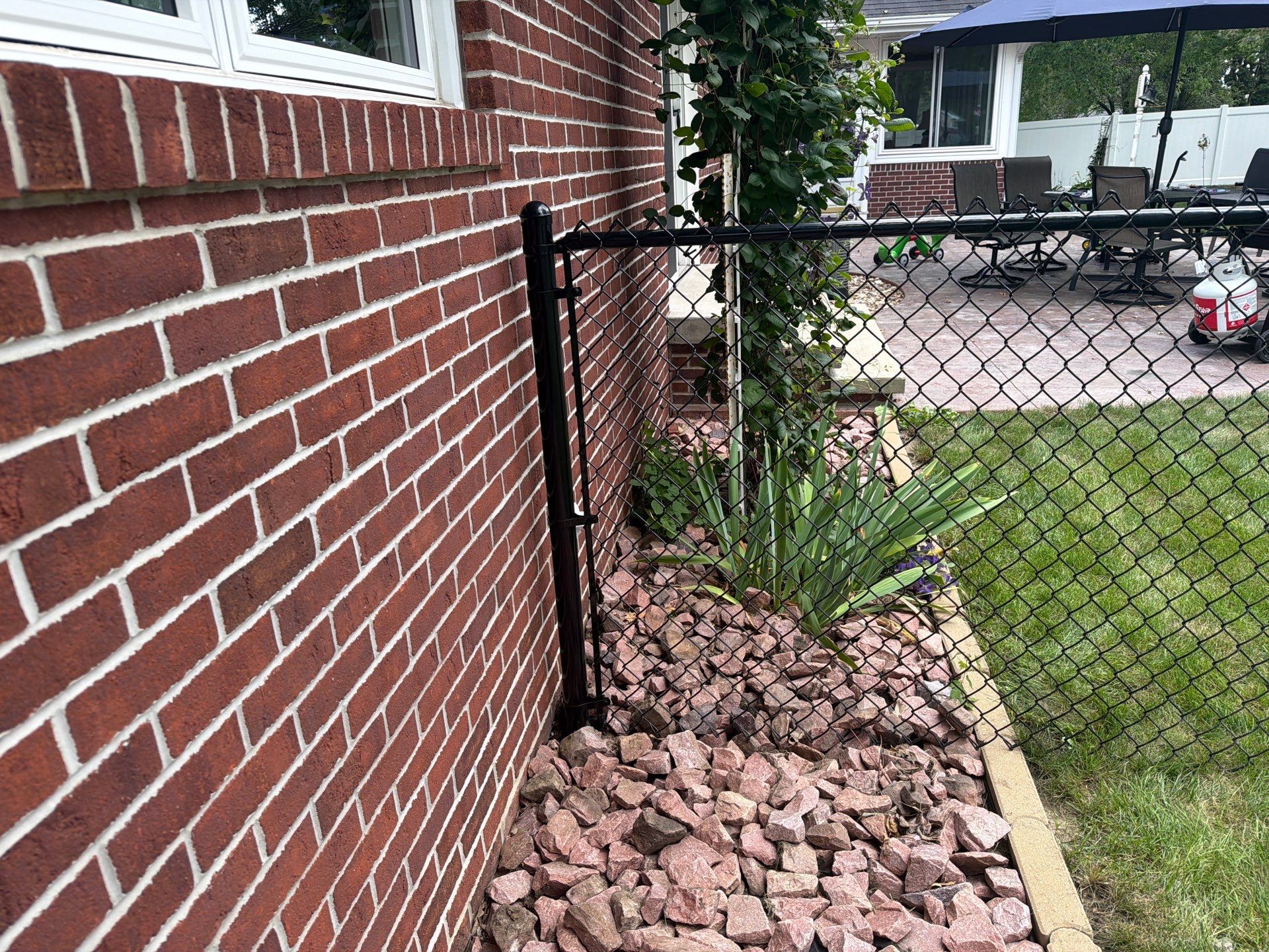 Residential White Vinyl Privacy and Black Chain Link Fencing in Jesup by Perfect Picket Fence and Stain