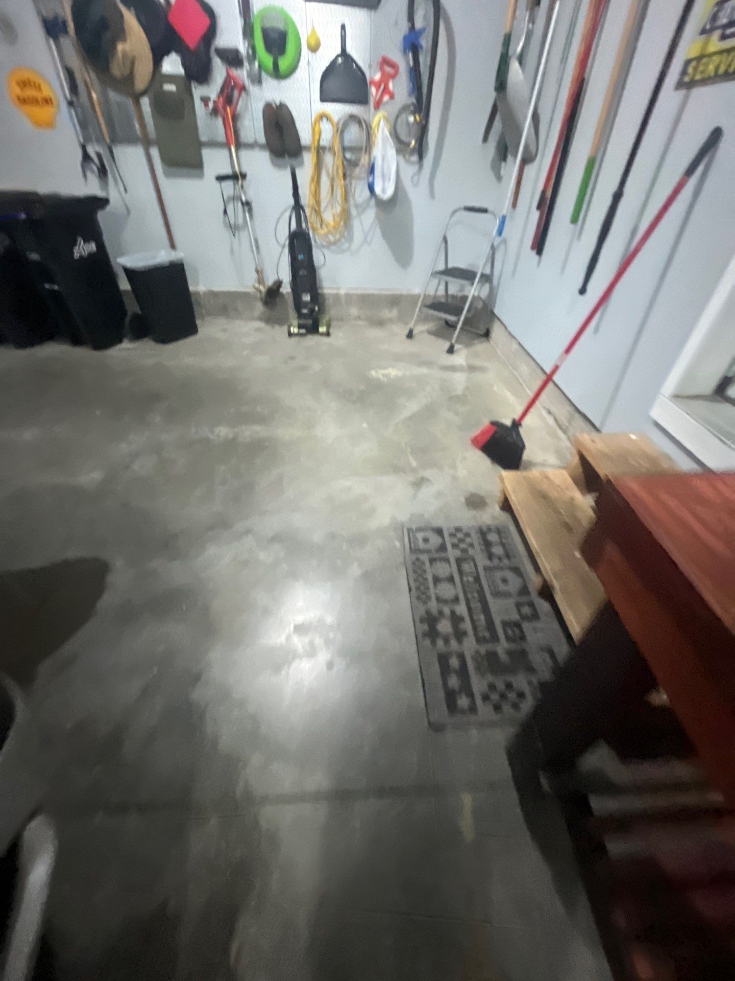 High-Gloss Epoxy Garage Floor Coating in Sioux Falls by Select Painting, Coatings & Garage Cabinets