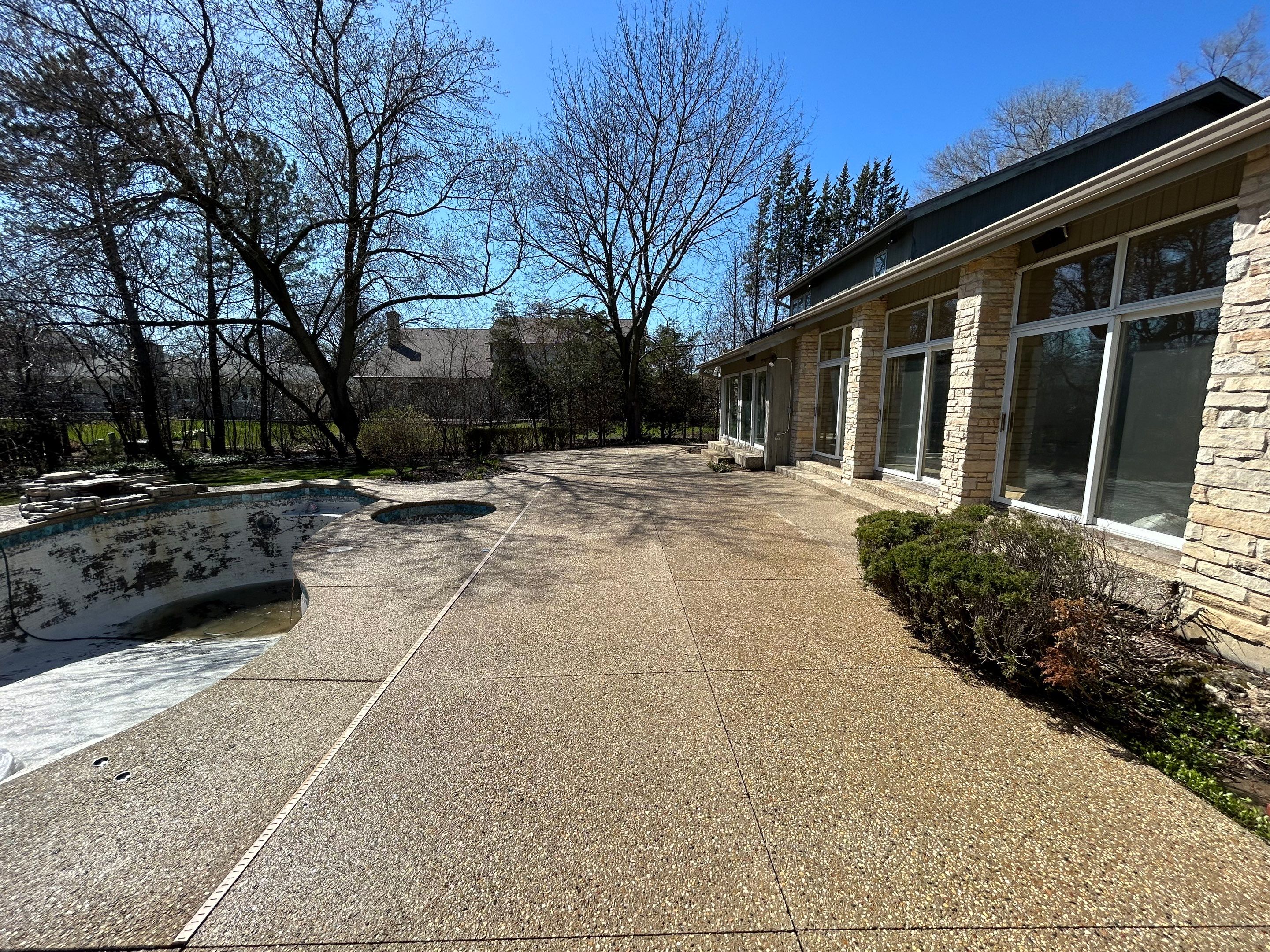 Aggregate Clean and seal using low gloss sealer by Northern Power Washing LLC.