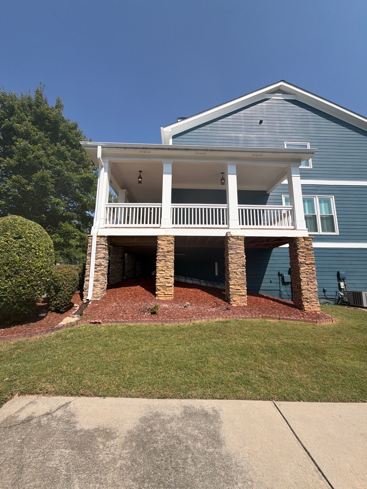 Atlanta Exterior Home Refresh with Blue Siding and Deck Staining by Swift Home Renovations 
