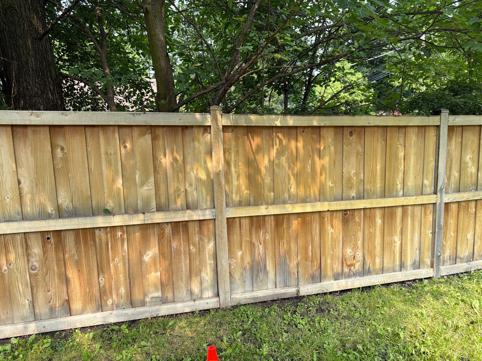 Wood fence cleaning and sealing by Northern Power Washing LLC.