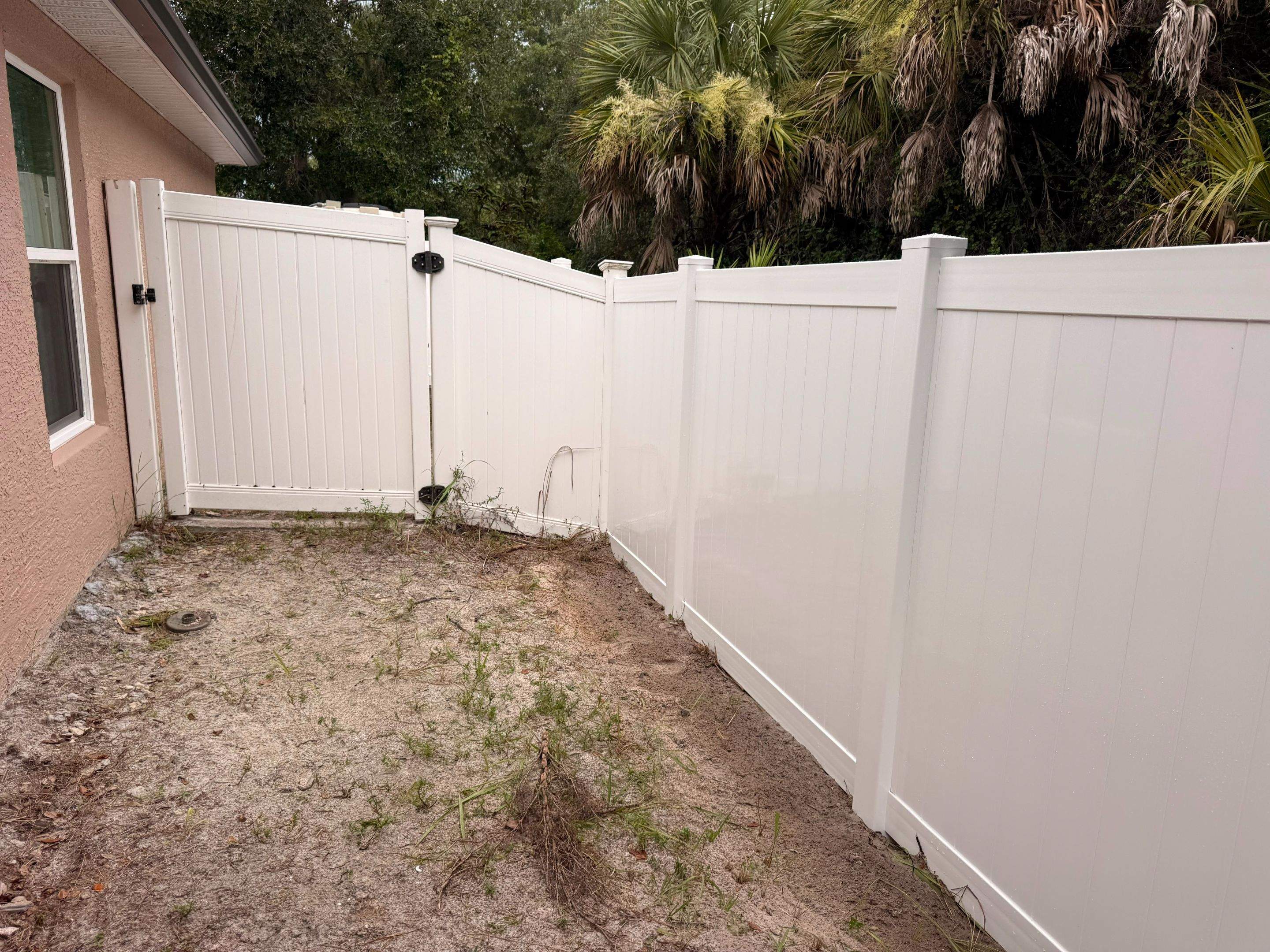 Vinyl Privacy Fence and Double Gate Installation in North Port by True Fence LLC