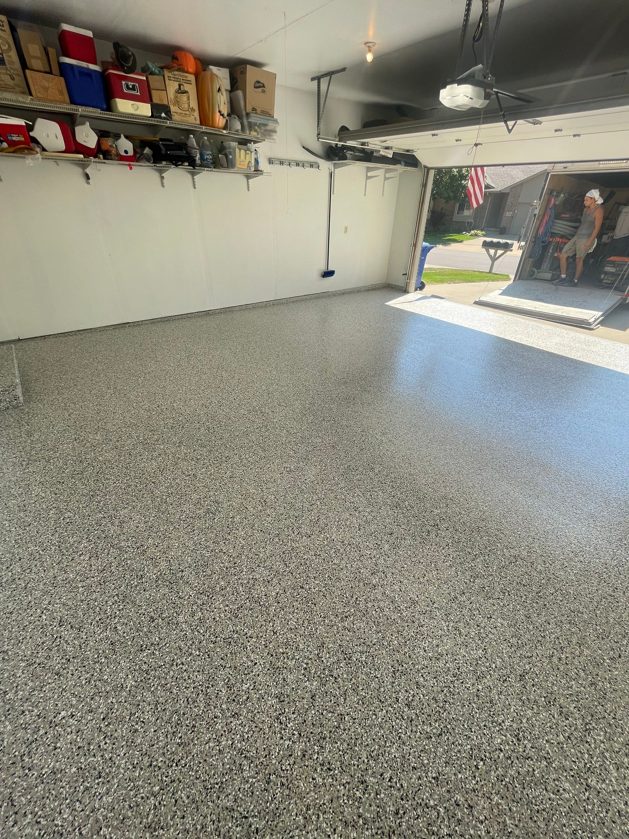 Sioux Falls Residential Garage Floor Coating with Speckled Epoxy Finish by Select Painting, Coatings & Garage Cabinets