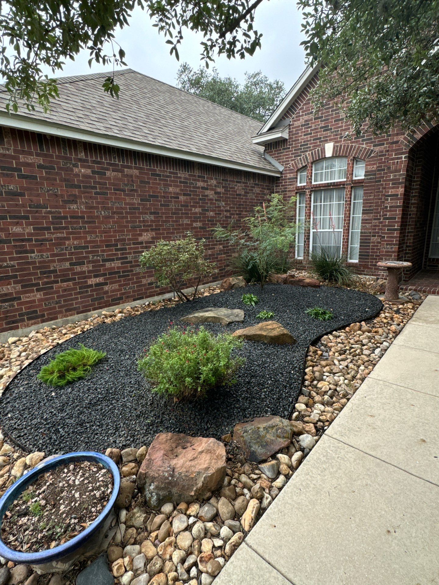 Landscaping Enhancement  using Texas Black Gravel by Hole In One Lawns, LLC
