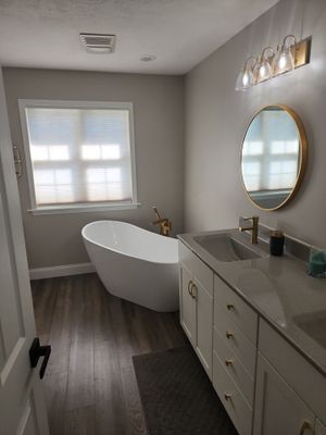 Master Bathroom Renovation Featuring Dark Textured Shower Panels in Branson West