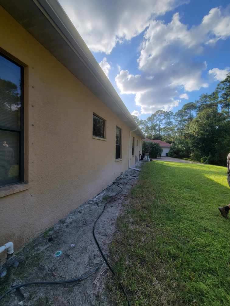 New Splash Guards and 6-Inch seamless Gutters in Naples FL by Gutter Professors