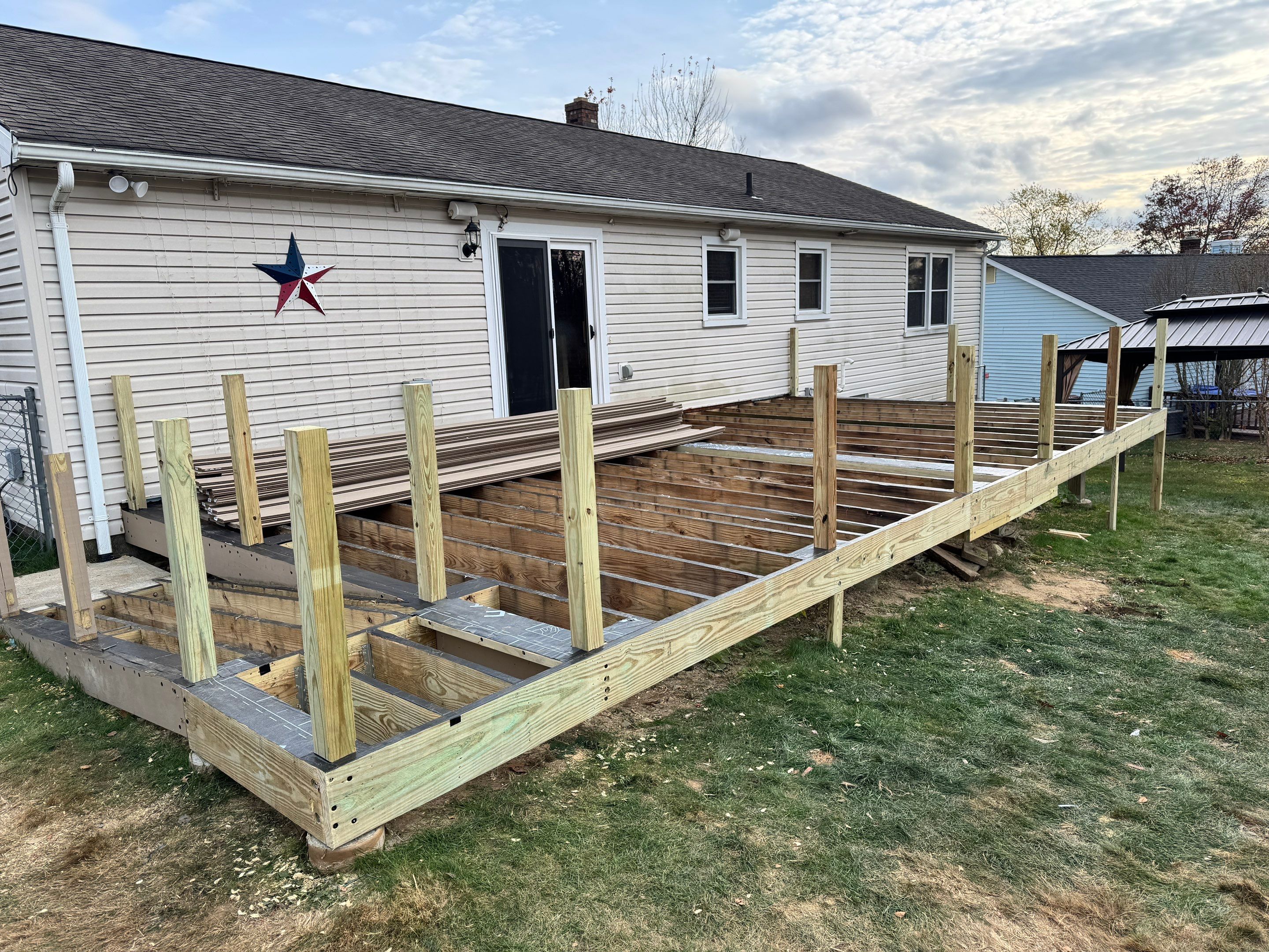 New pool deck and main deck resurface using Trex Transcend Rope Swing boards, White railing and Lattice by DiGiorgi Roofing and Siding Inc