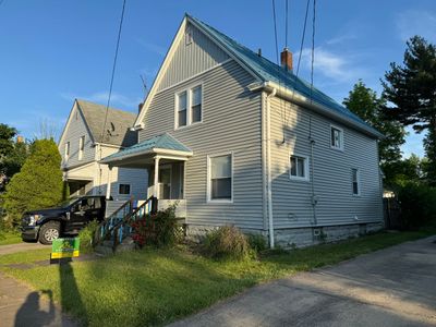Exterior Remodel using Alside Charter Oak, Premier Metals Custom Metal Roofing