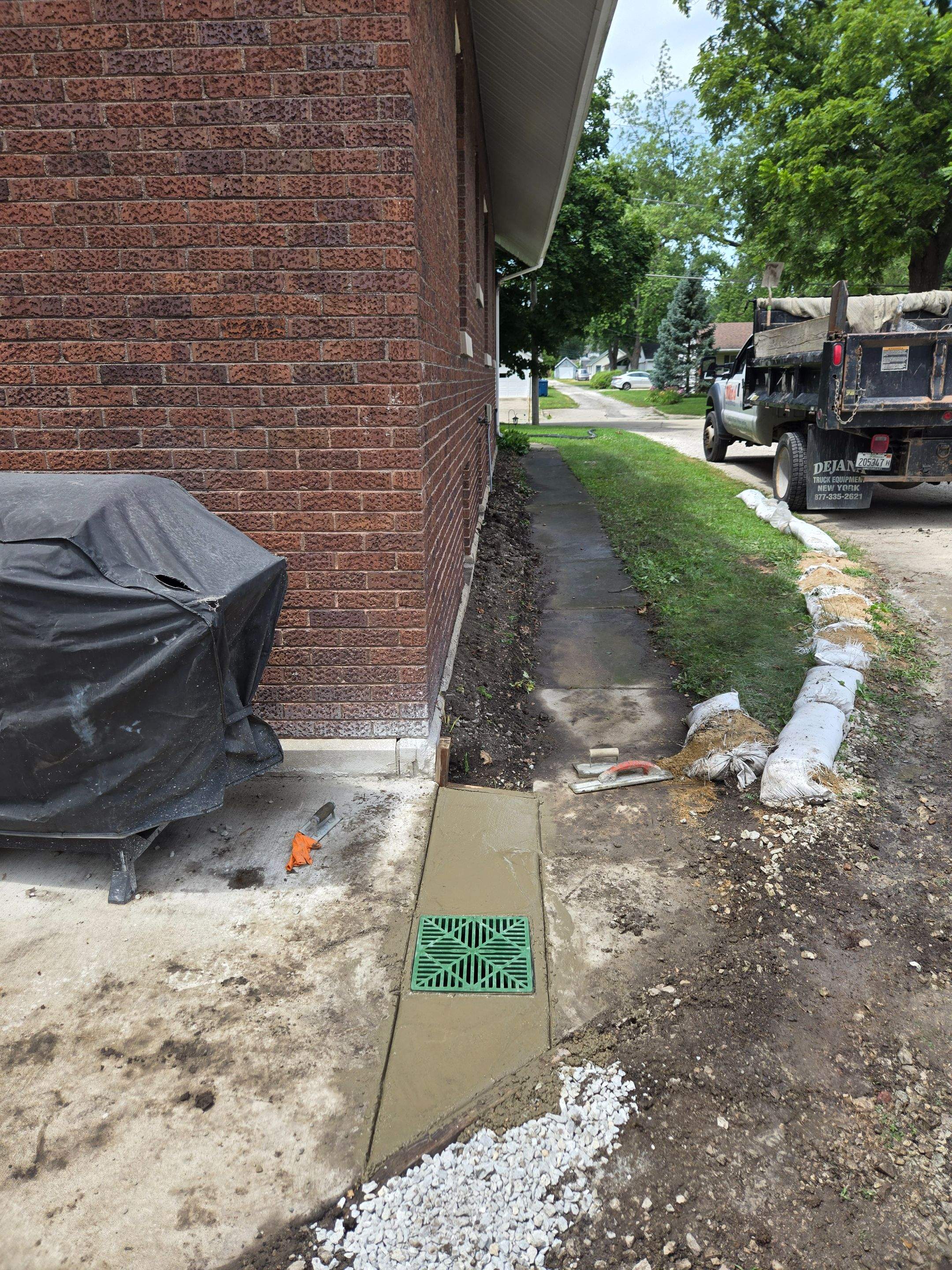 Enhanced Exterior Water Capture Basin With Ultimate Water Drainage French Drain System by Allied Water Services