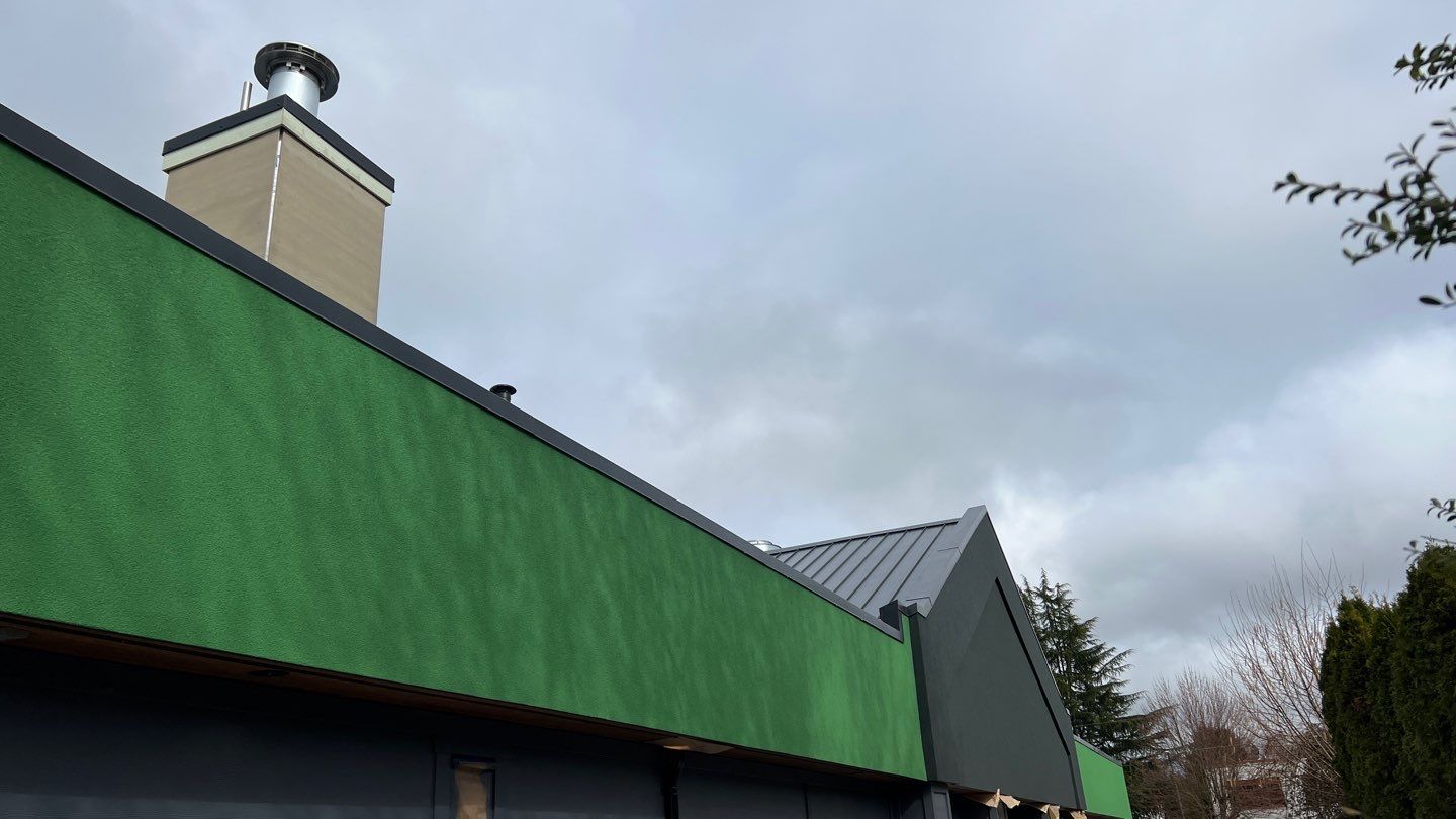 Commercial Roofing Installation using 12" Prolok metal and hidden gutters! by Top Notch Roofing Inc