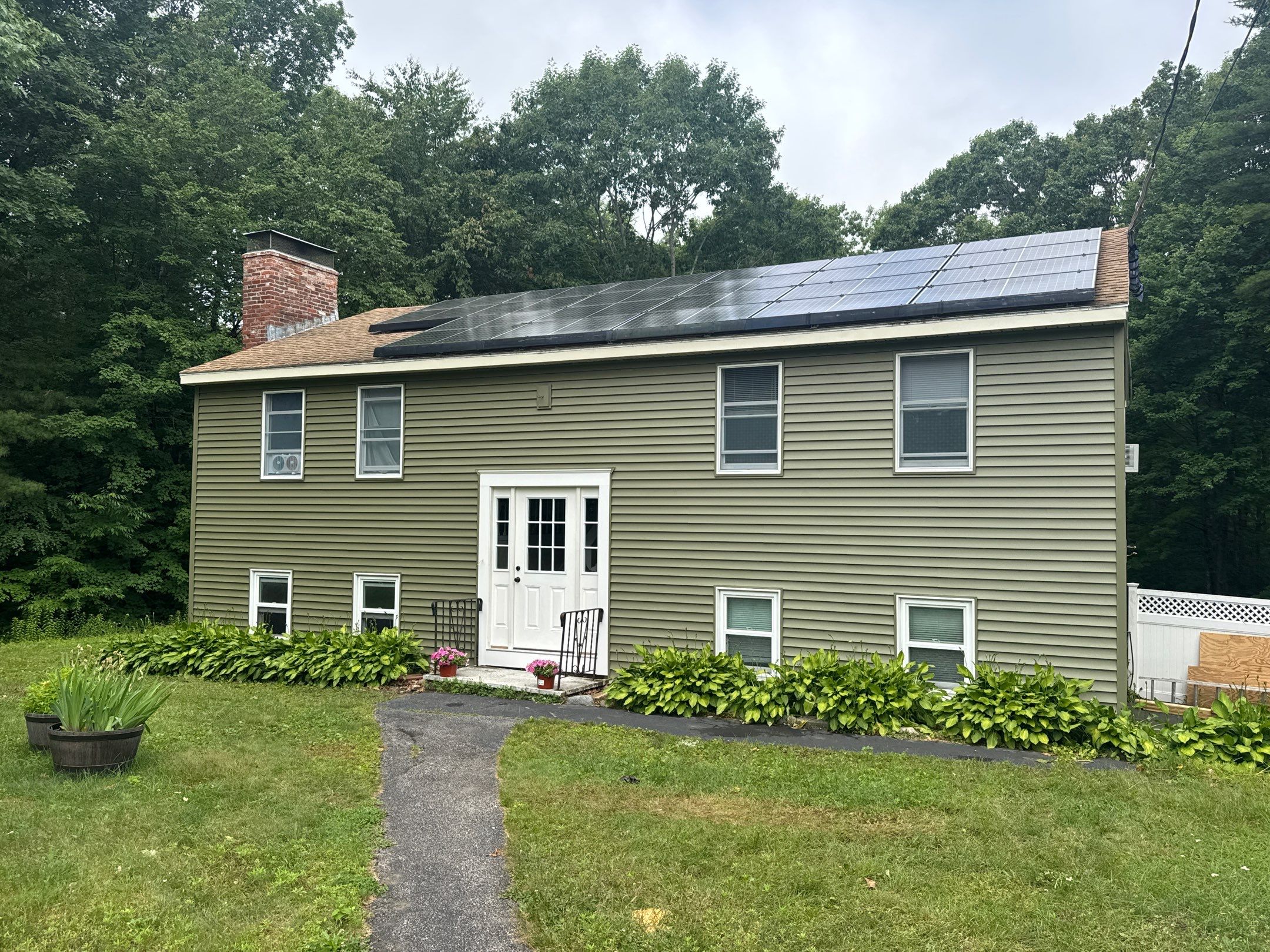 Full Siding Replacement in Newmarket, NH with CertainTeed Vinyl Siding and New Front Door Installation by Compass exteriors