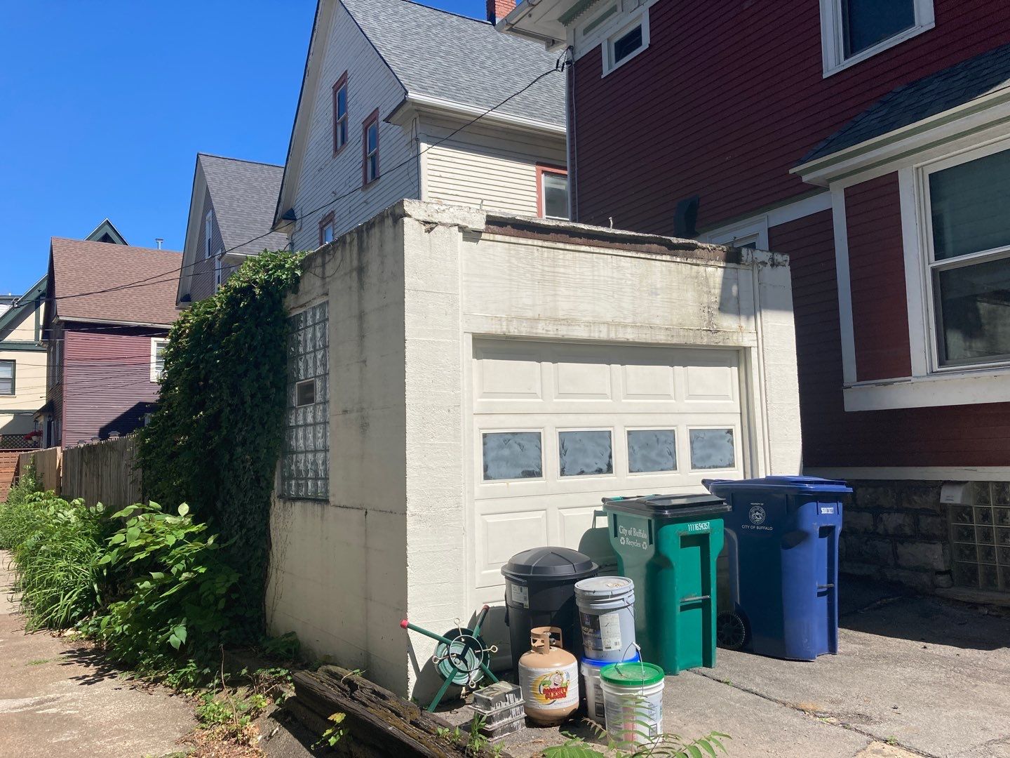 Exterior Renovations- Siding, Stamped Concrete, Porch, and Railings by Ivy Lea Construction