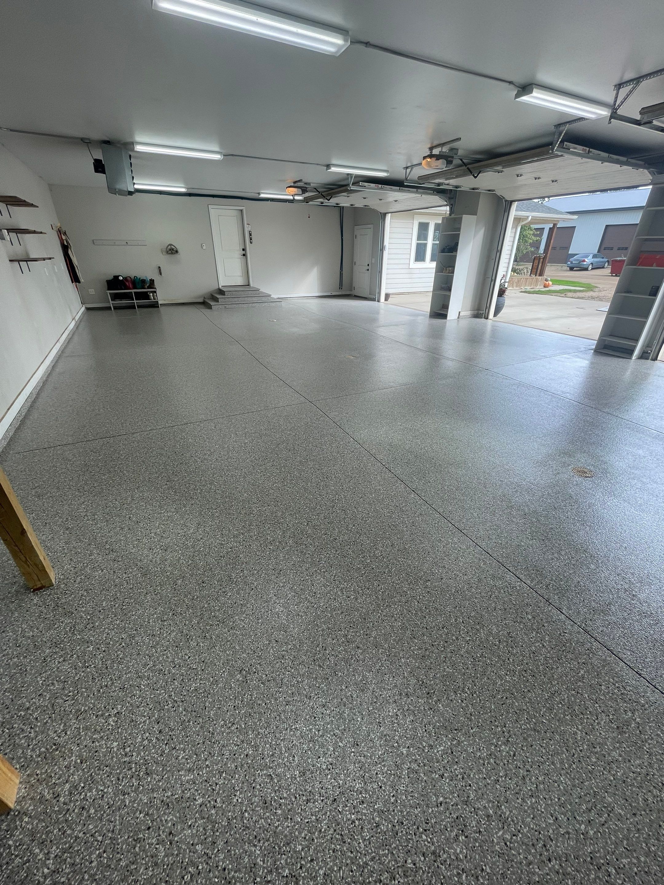 Grey Speckled Polyuera Garage Floor Coating for Hartford Three-Car Garage by Select Painting, Coatings & Garage Cabinets