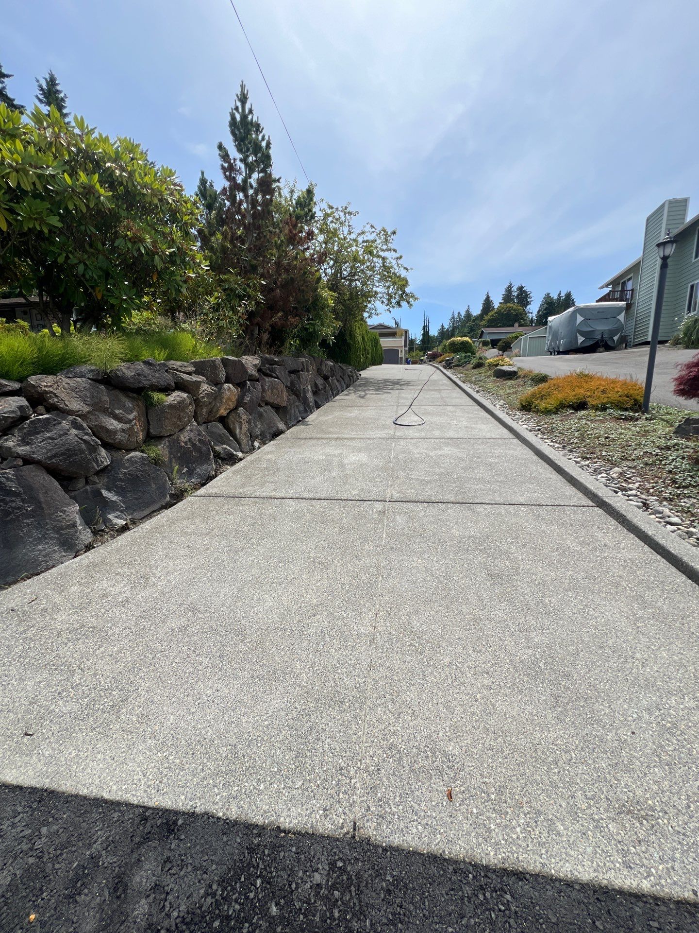 Concrete Driveway Makeover w/ Asphalt Patch | Everett  by Jireh Asphalt & Concrete Inc 