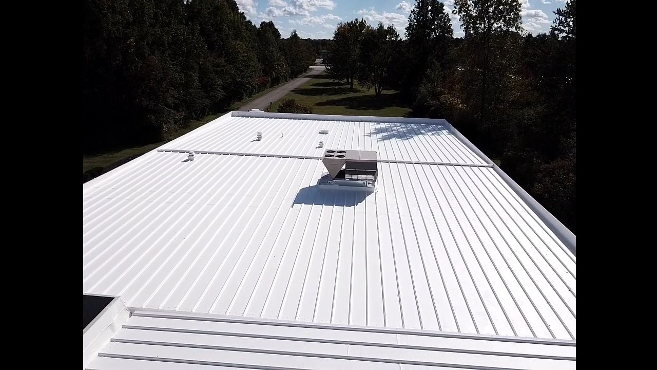 Commercial Metal Roof Coating by Gold Star Roofing LLC