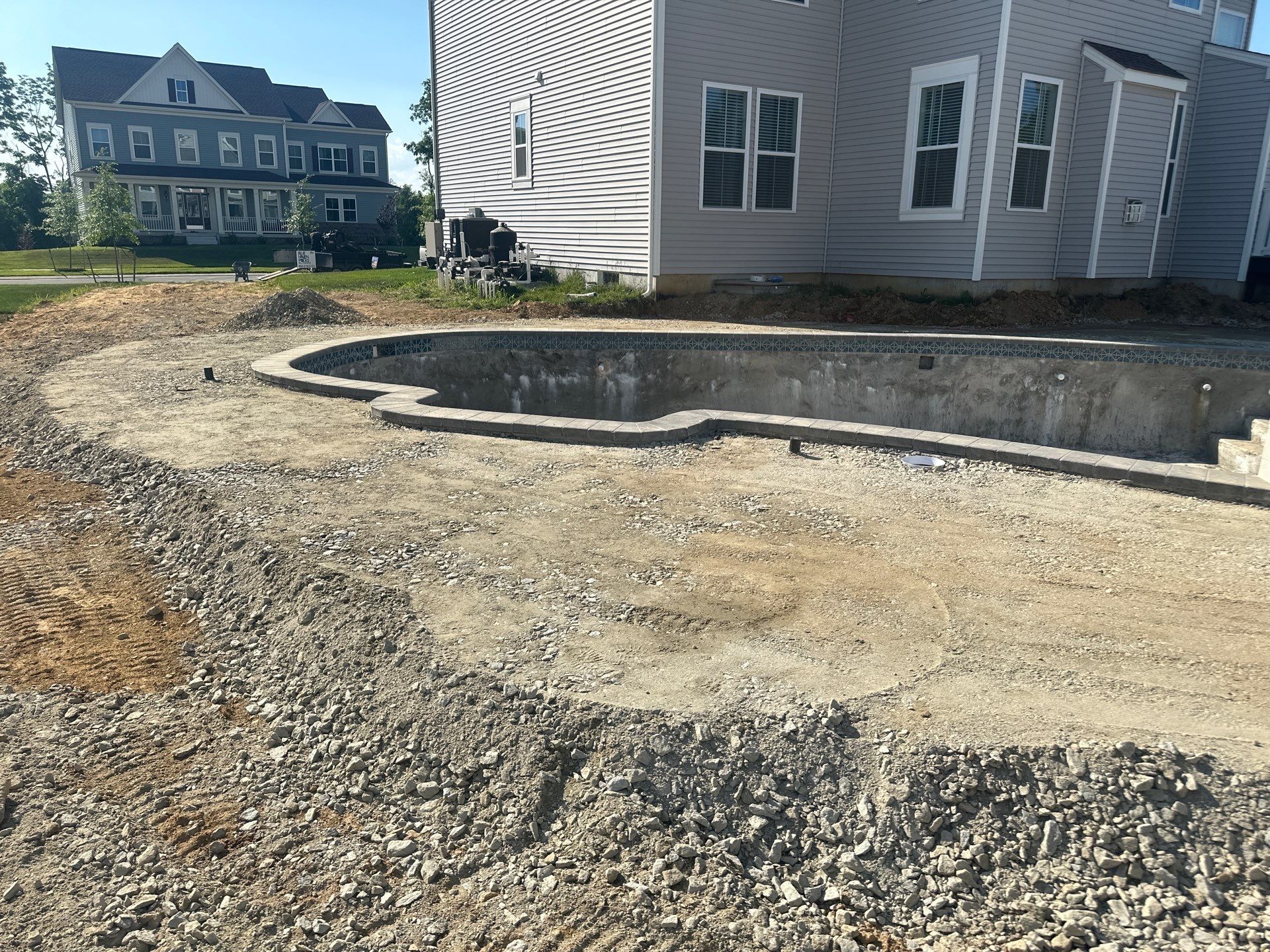 Pool and Hardscape Design in Delaware | Belgard Paver Patio & Outdoor Living Space by Studio G Indoor Spaces & Outdoor Living