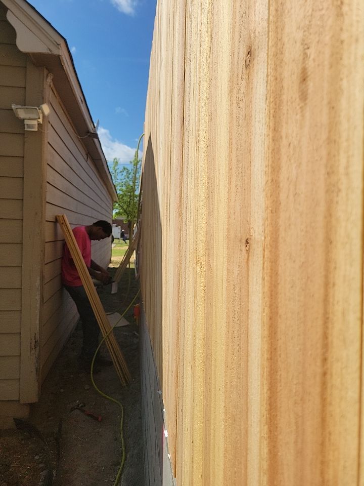 Cedar Fence using Cedar Pickets and Metal Poles by Clays Services Inc