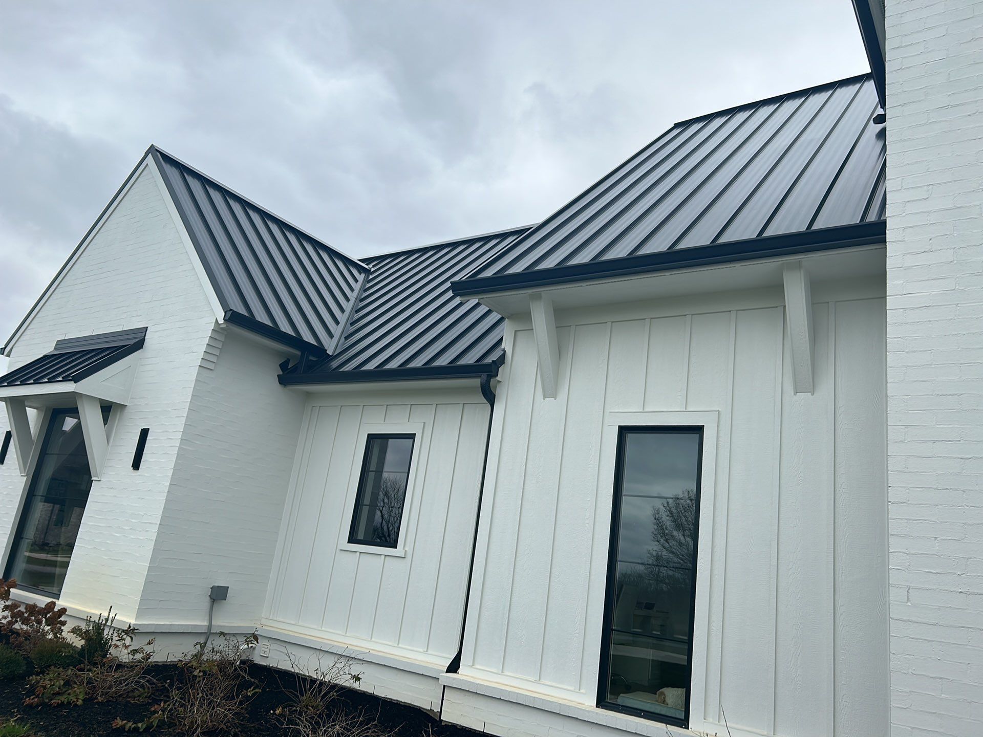 Residential Roofing Installation using Standing Seam Metal - Frost Black by RoofX 