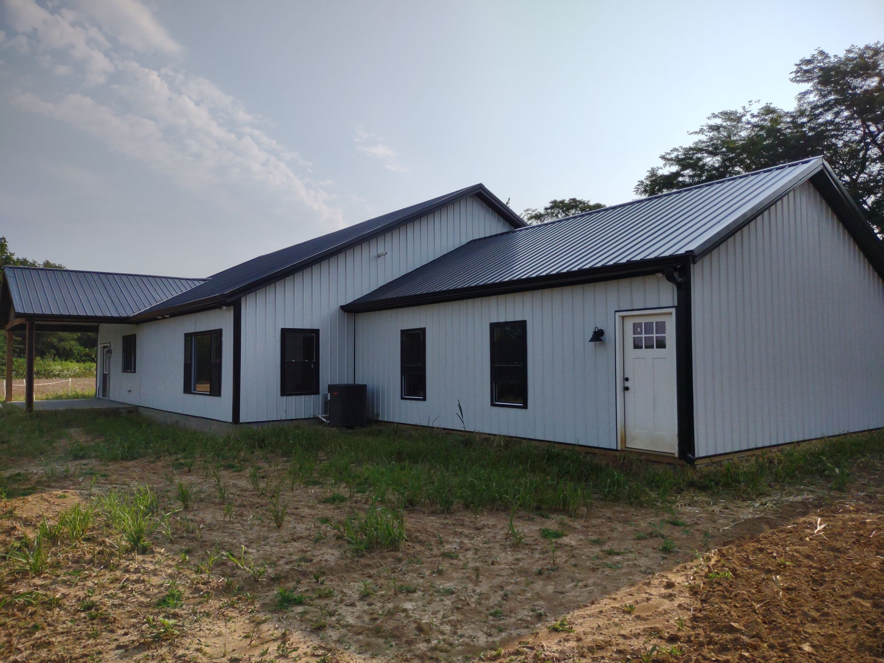 Pole Barn Home  by The Barn Builders 