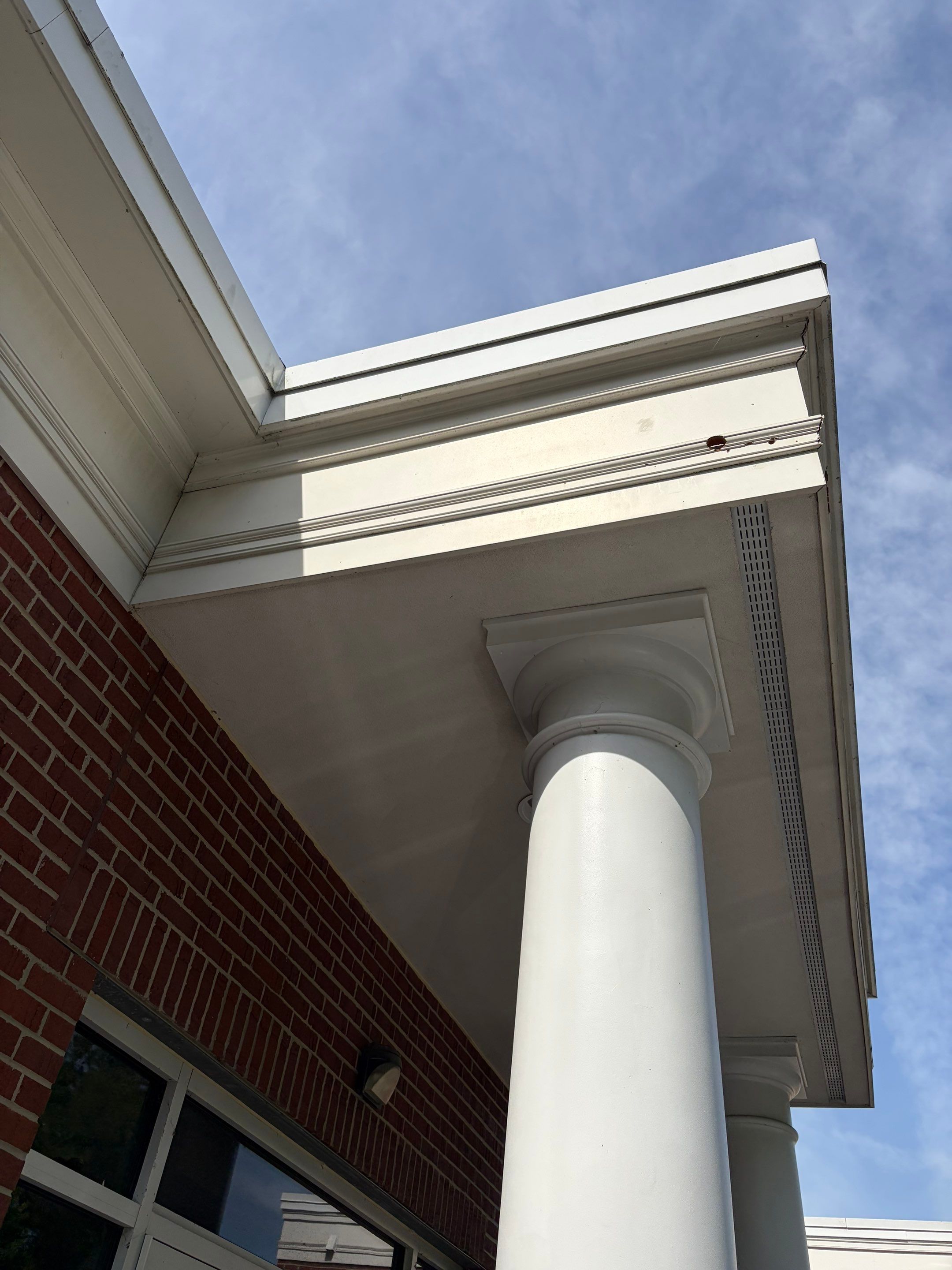 Commercial Wood Trim Restoration and Gutter Replacement in Birmingham by Top Shelf Painter
