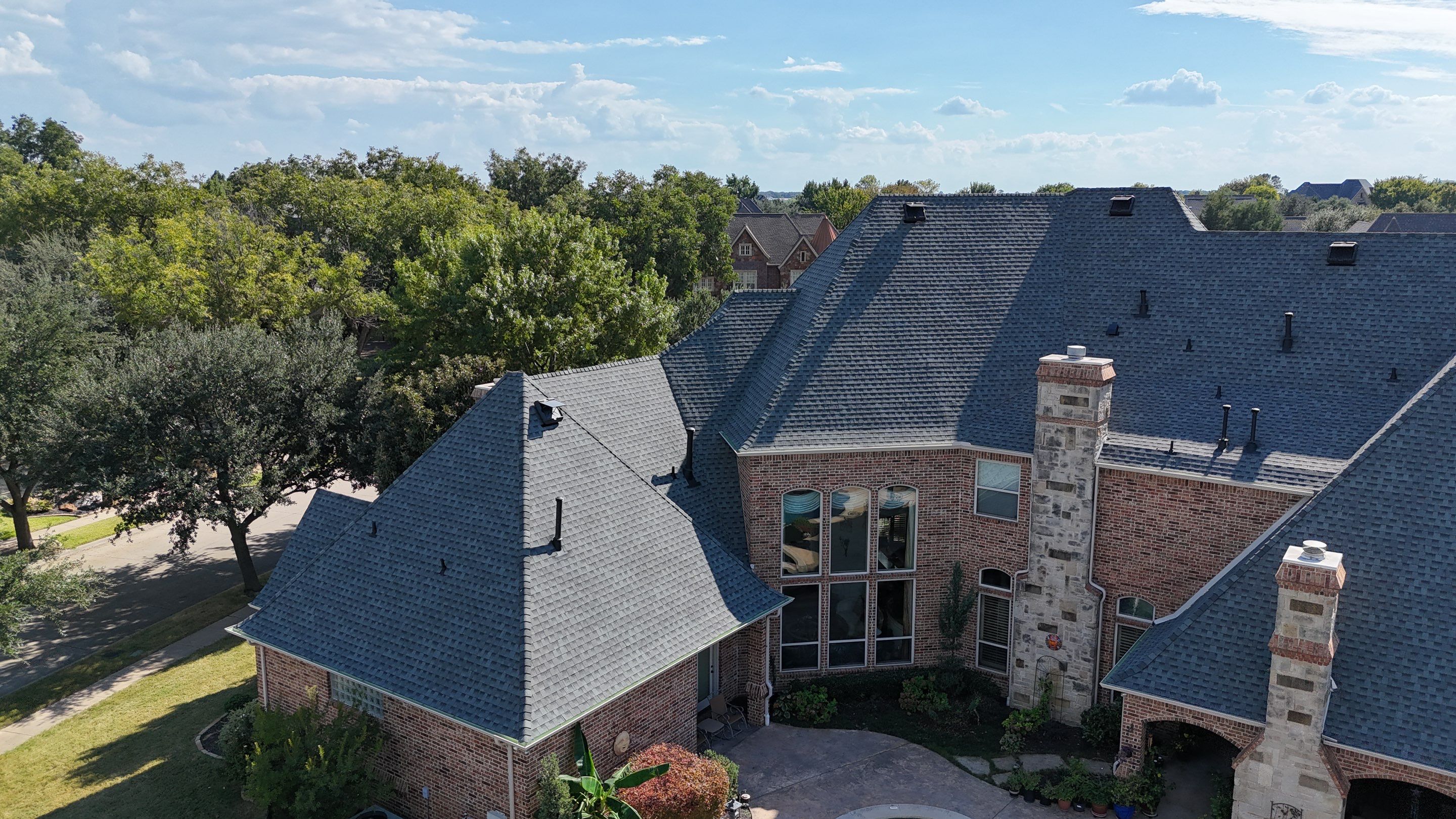 Southlake Texas Estate - Roof, Copper Awning and Gutter Project by First United Roofing & Construction