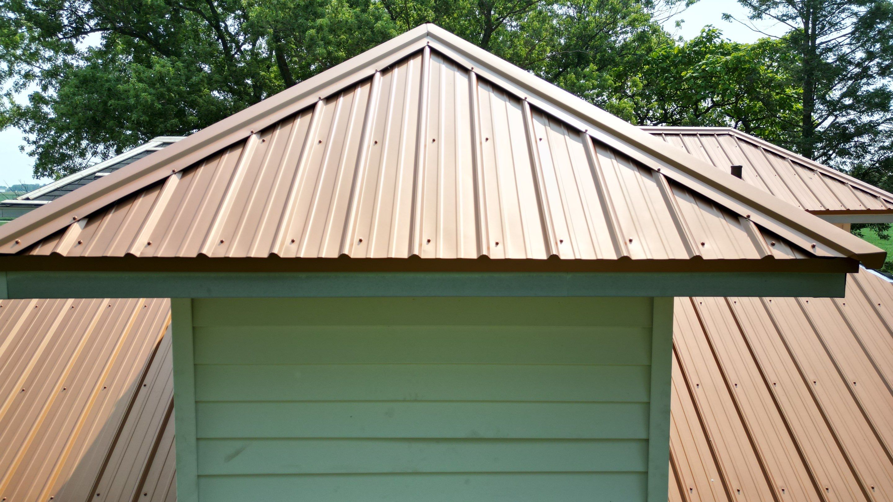 Residential Roofing Installation using Performance Panel Metal - Copper Metallic by RoofX 