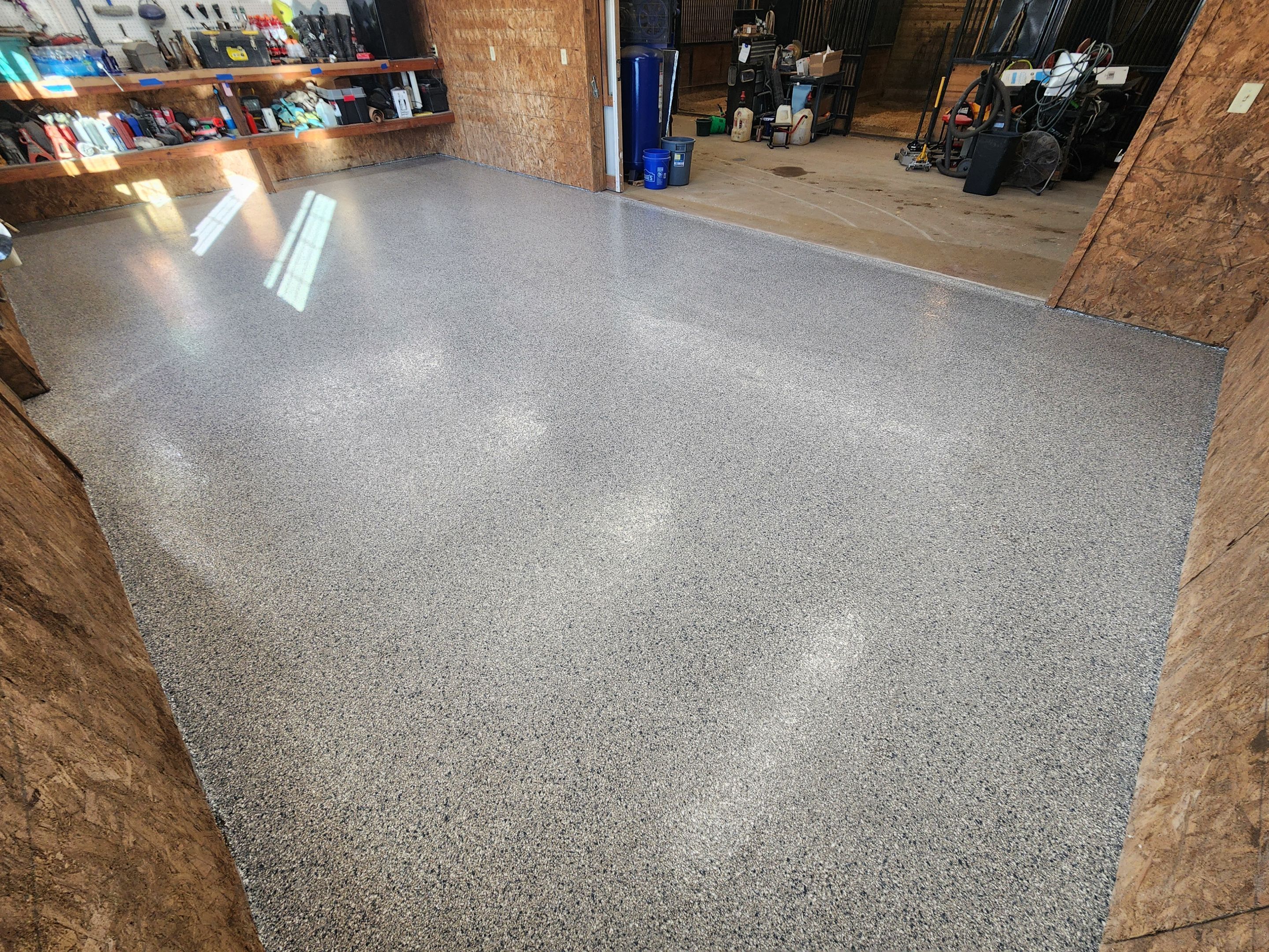 Basement using Tidalwave by Select Painting, Coatings & Garage Cabinets