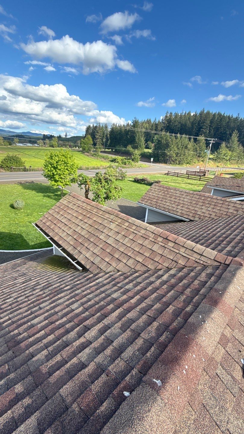 Residential Roof Replacement with Metal Accents by Orezona Building & Roofing Company, Inc.