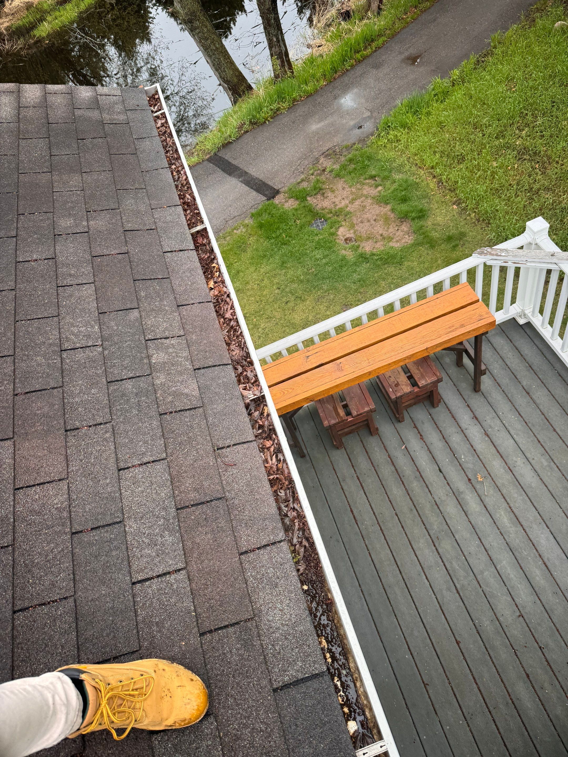 Commercial gutter cleaning Minneapolis & St. Paul, MN before photo with filled gutters
