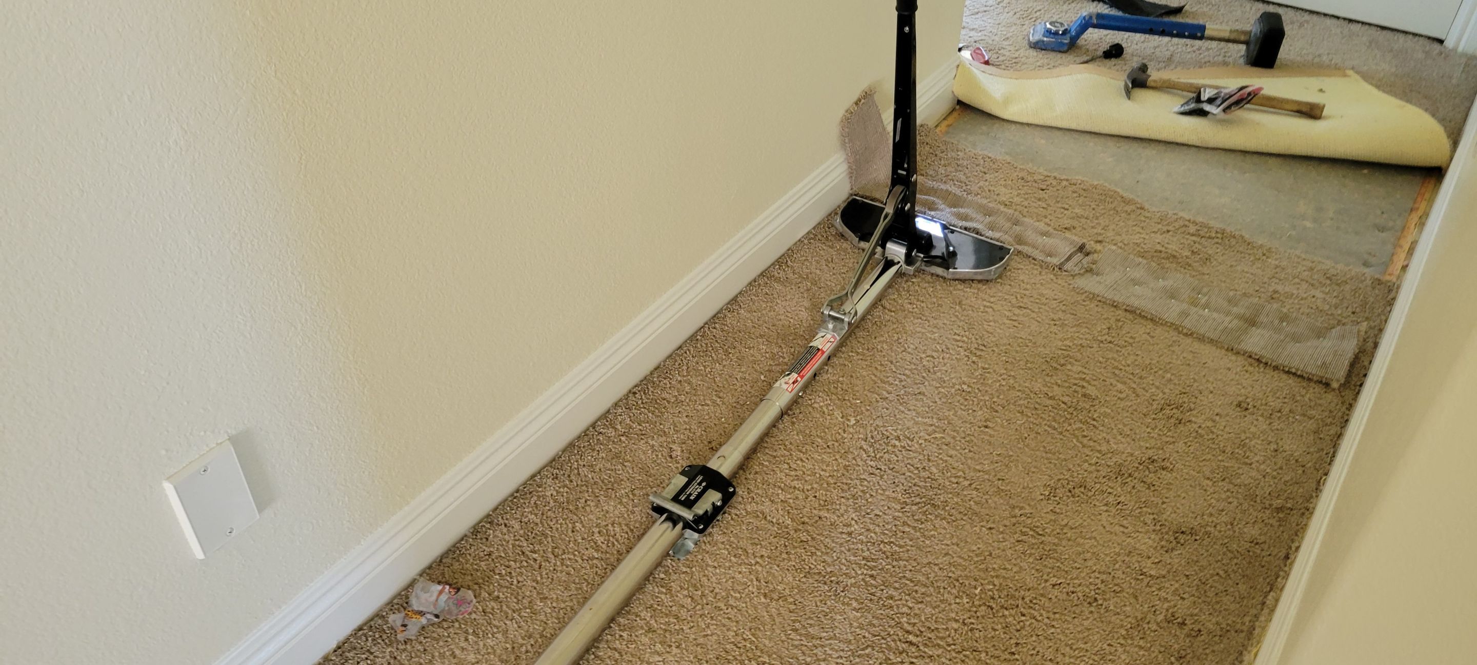 Stretching Hallway Carpet of a Rental by Ardent Carpet Restore LLC
