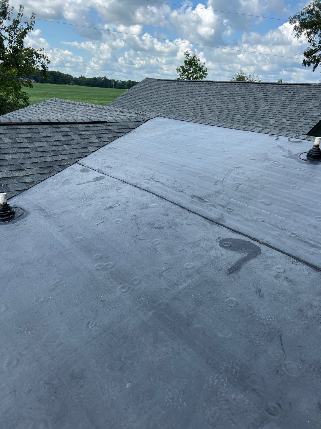 Residential Roofing Installation using 60 mil rubber roof  by Nitro Roofing and Construction