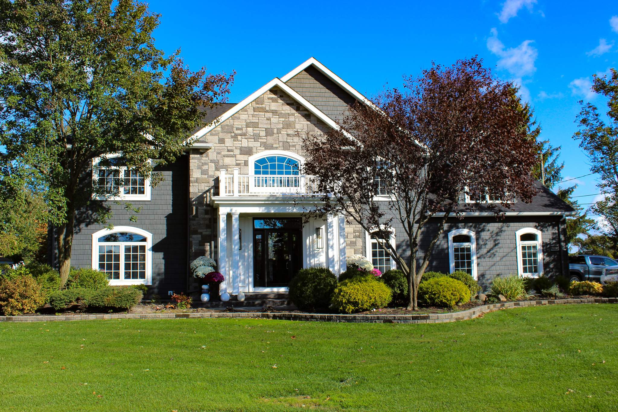 Exterior Renovations- Siding, Concrete, Railings, and Entry Door  by Ivy Lea Construction