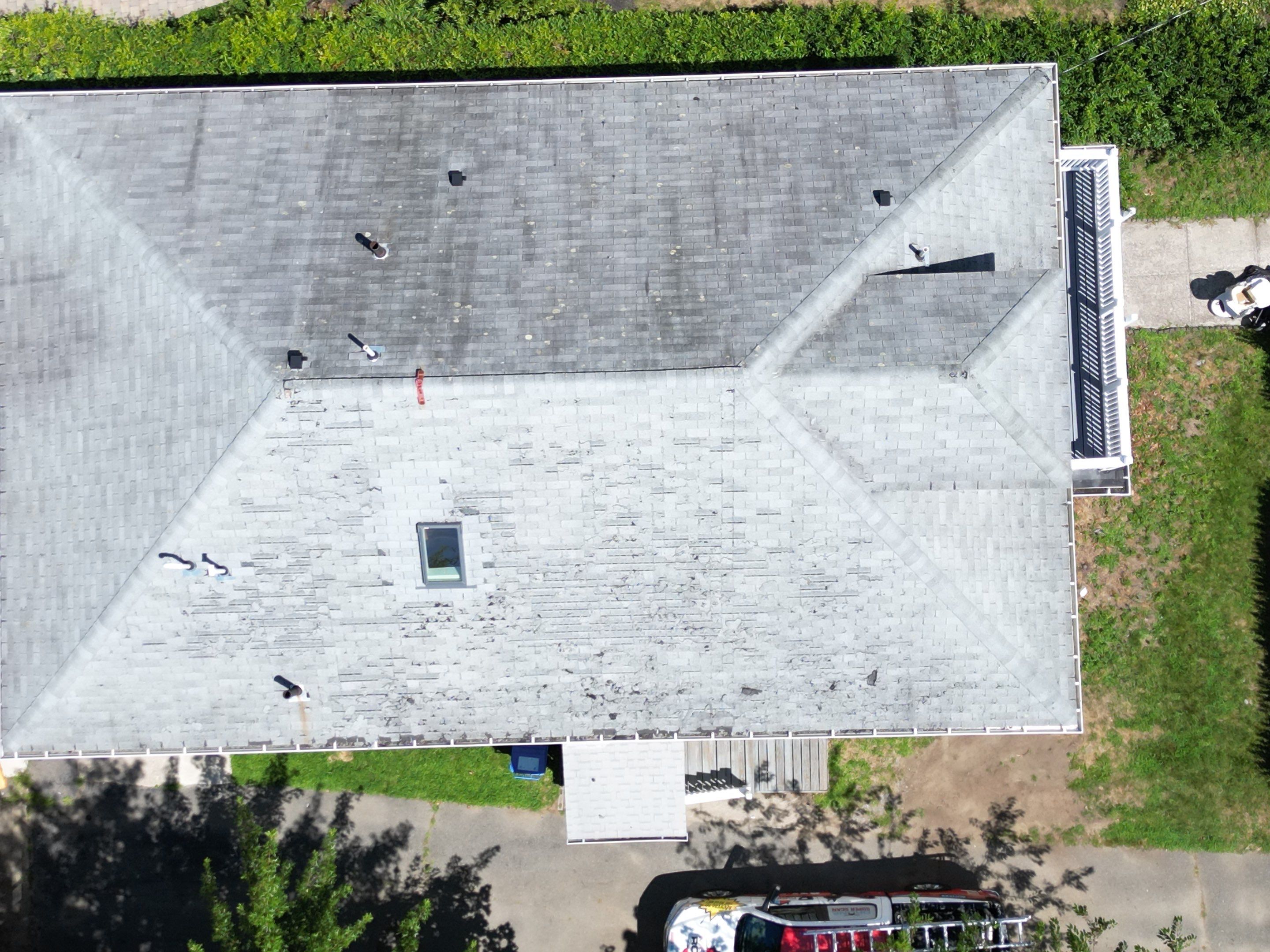 Roof Replacement with Skylight Flashing in Waltham, MA by Mighty Dog Roofing of Greater Middlesex County