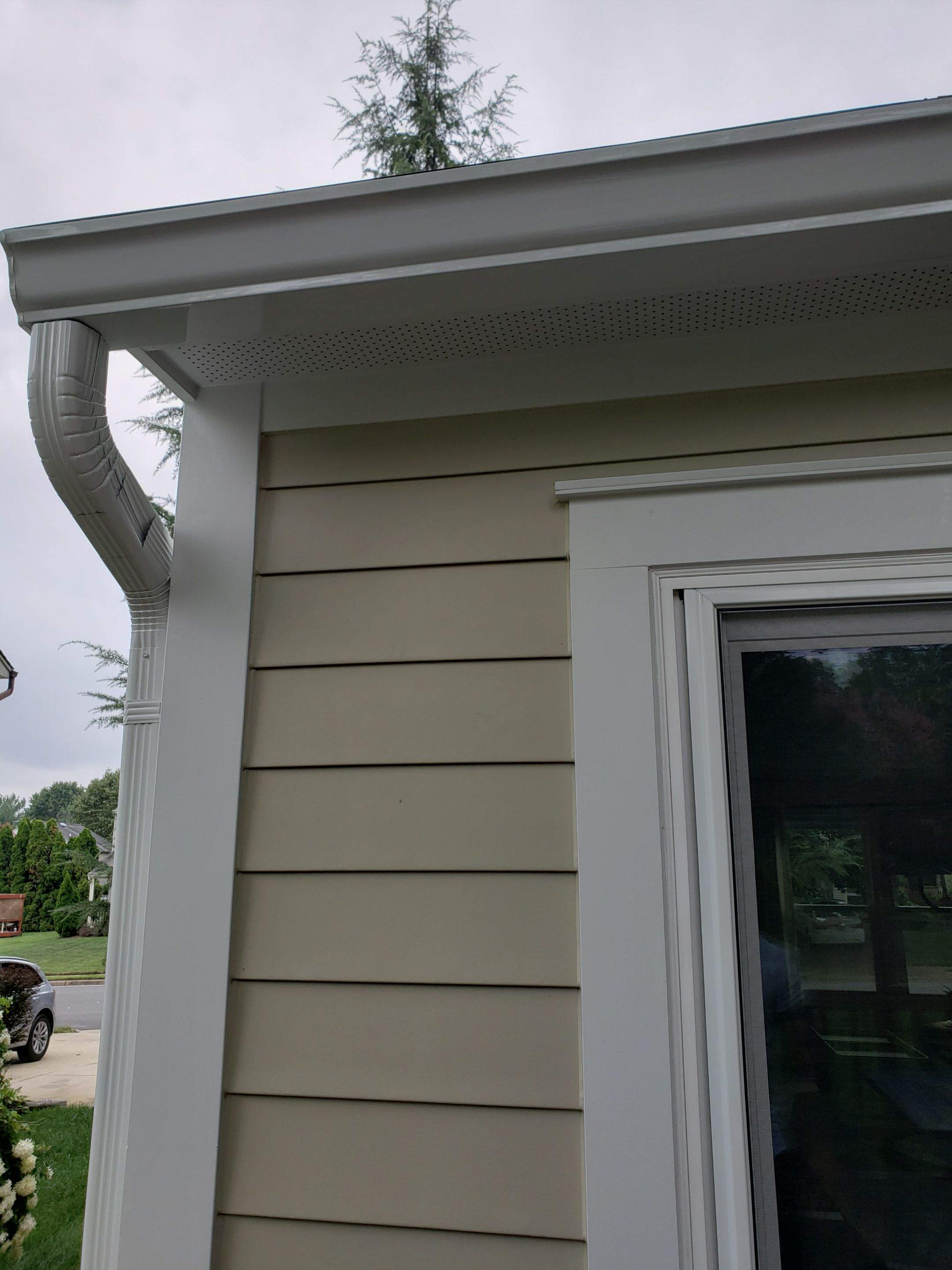 New composite windows and fiber cement siding with trim and gutters by Window Depot of Annapolis