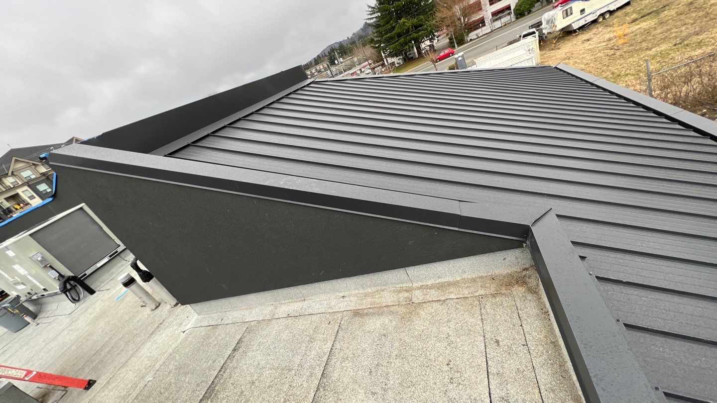 Commercial Roofing Installation using 12" Prolok metal and hidden gutters! by Top Notch Roofing Inc