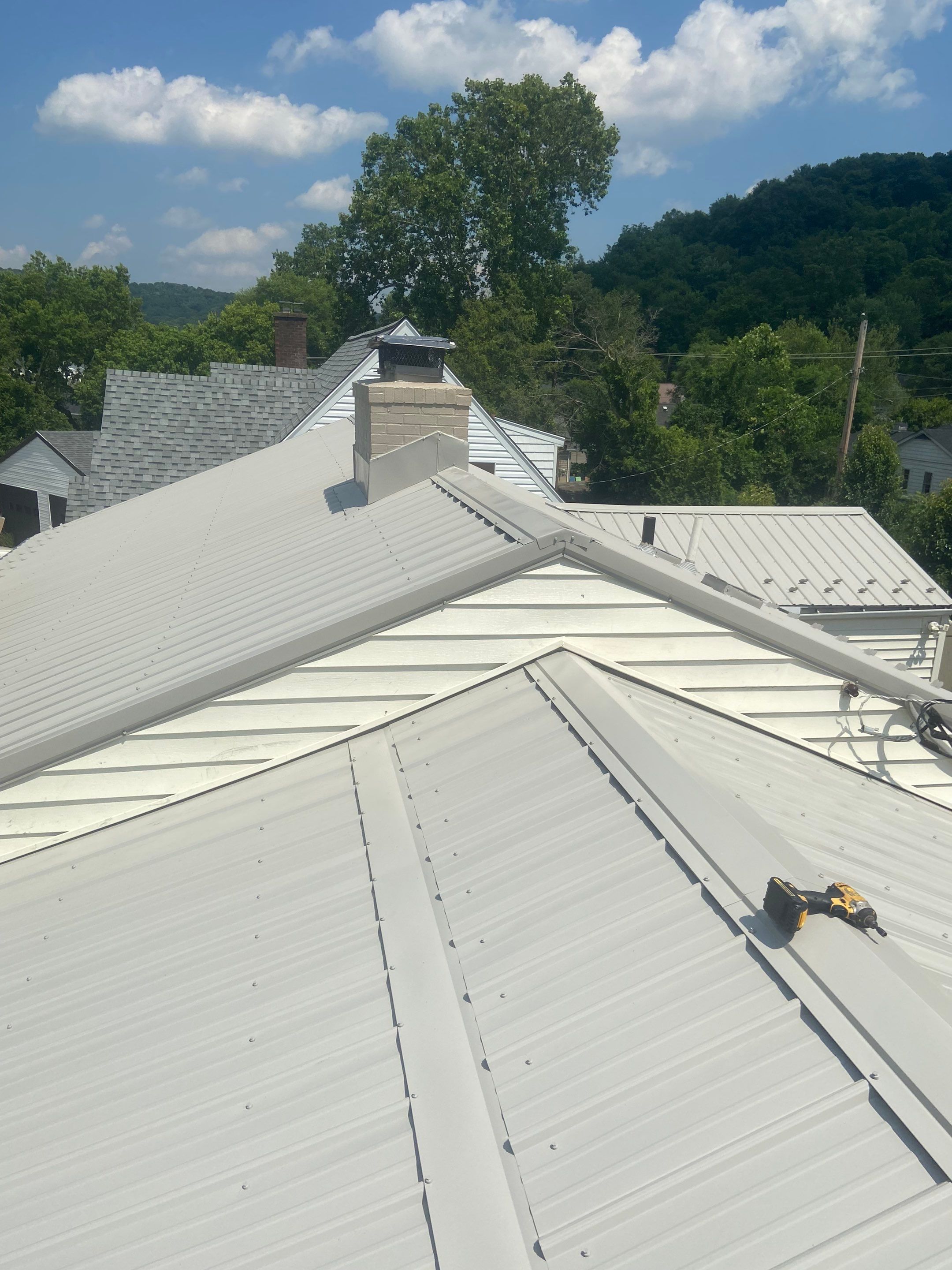 Metal Roofing, Skylights, Porch Build by Secure Construction Company Inc