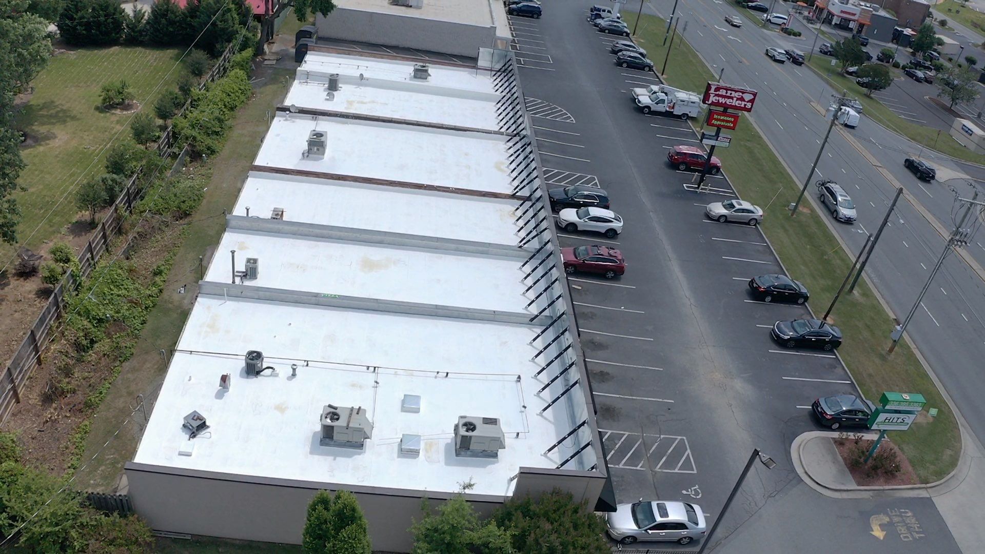 Commercial Roof Coating using Fiberseal basecoat and Silicon Topcoat by Just In Time Roofing and Restoration
