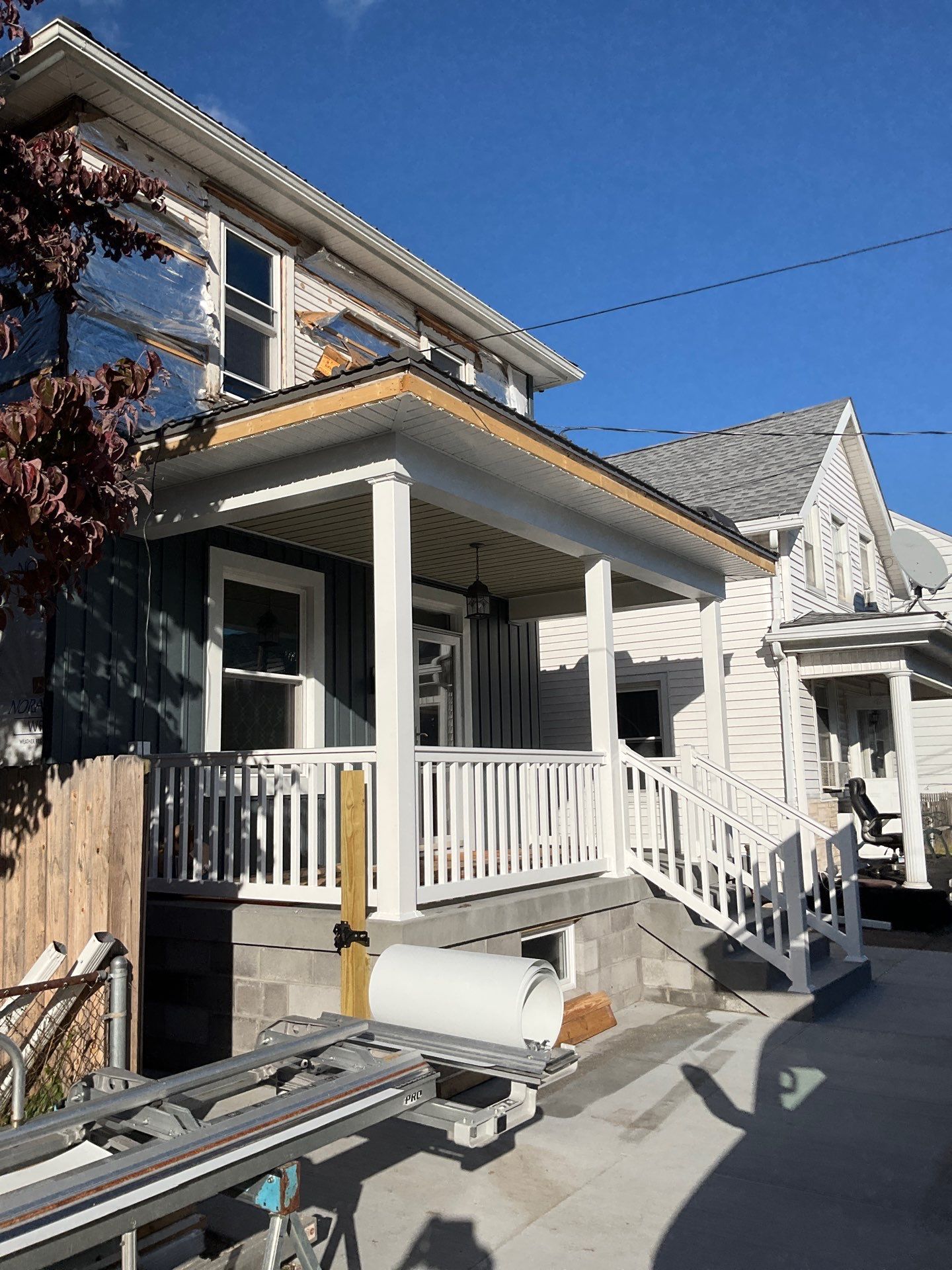 Charcoal Metal Roof & Blue Siding — A Refreshing New Look by Esh Builders