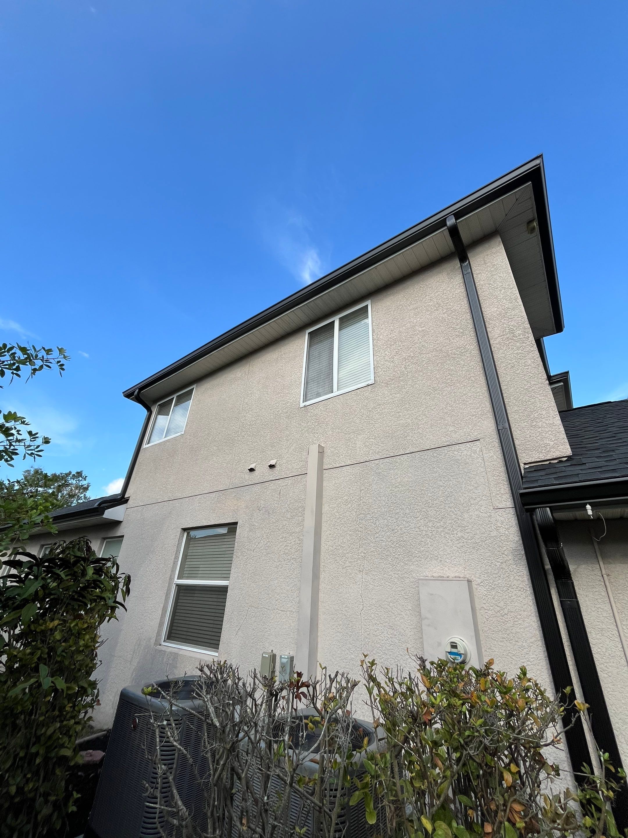 Black 6-inch Seamless Gutters for Modern Ellenton Homes FL by Gutter Professors