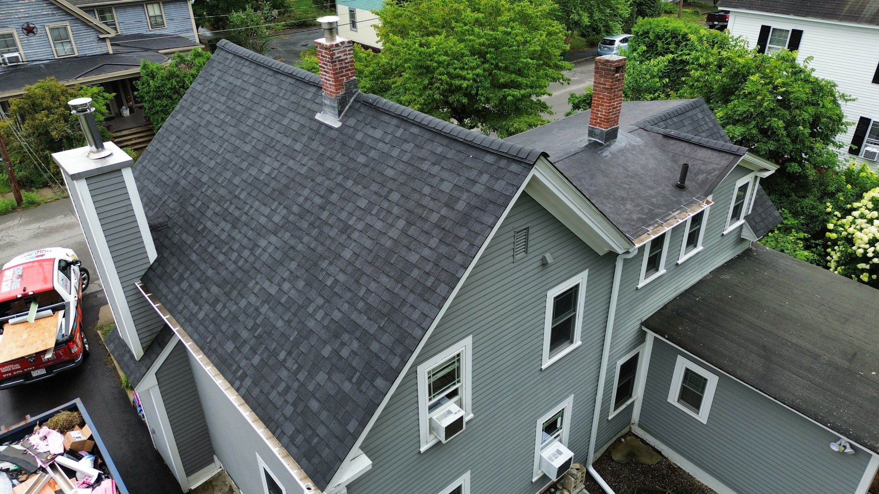 Full Roof Replacement + Custom Gutter Install | Onyx Black Finish by Mighty Dog Roofing of Greater Middlesex County