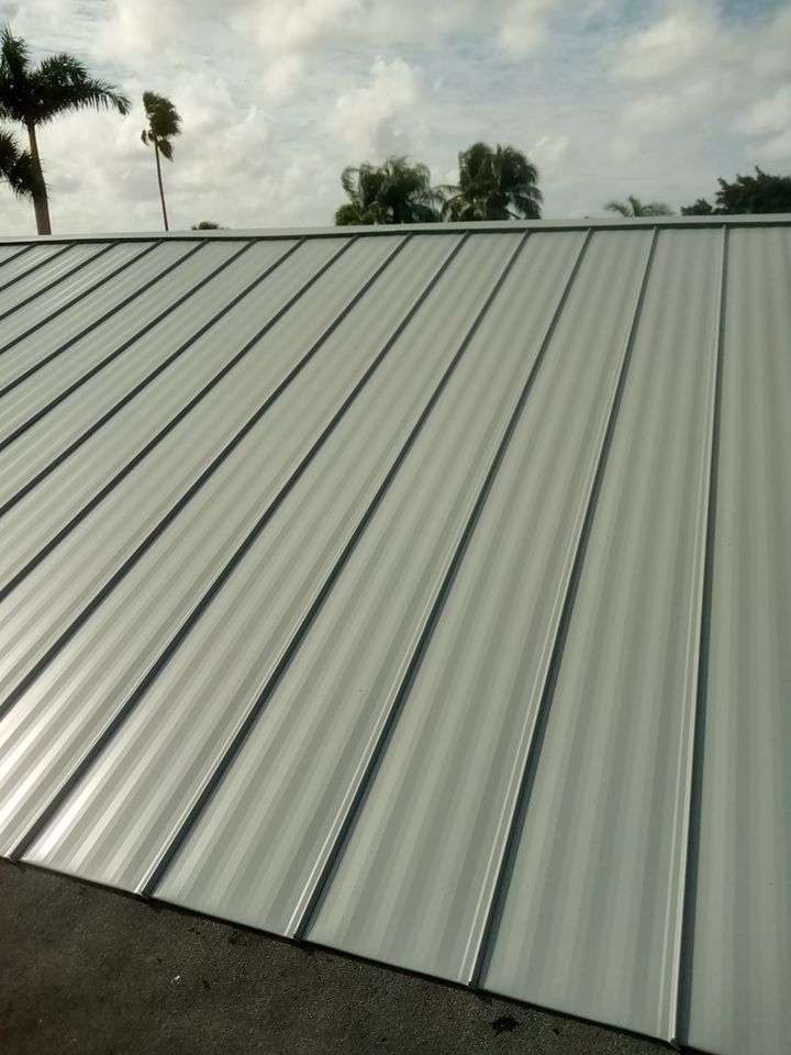 Residential Roofing Installation using 1" Nail strip metal roof by BLUES BROTHERS CONSTRUCTION CORP