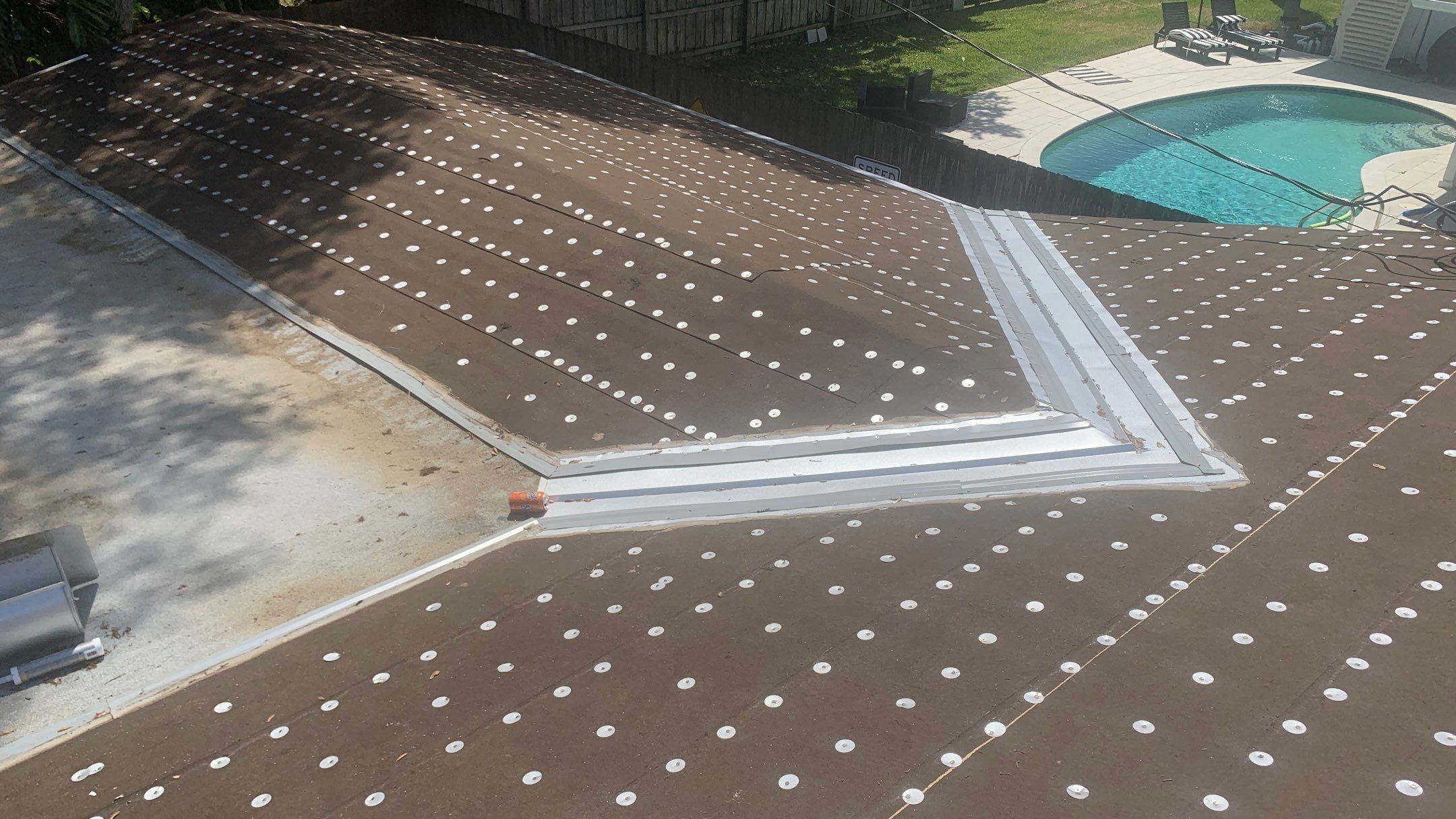 Residential Roofing Installation using 1.5'' Mechanical Seam by BLUES BROTHERS ROOFING