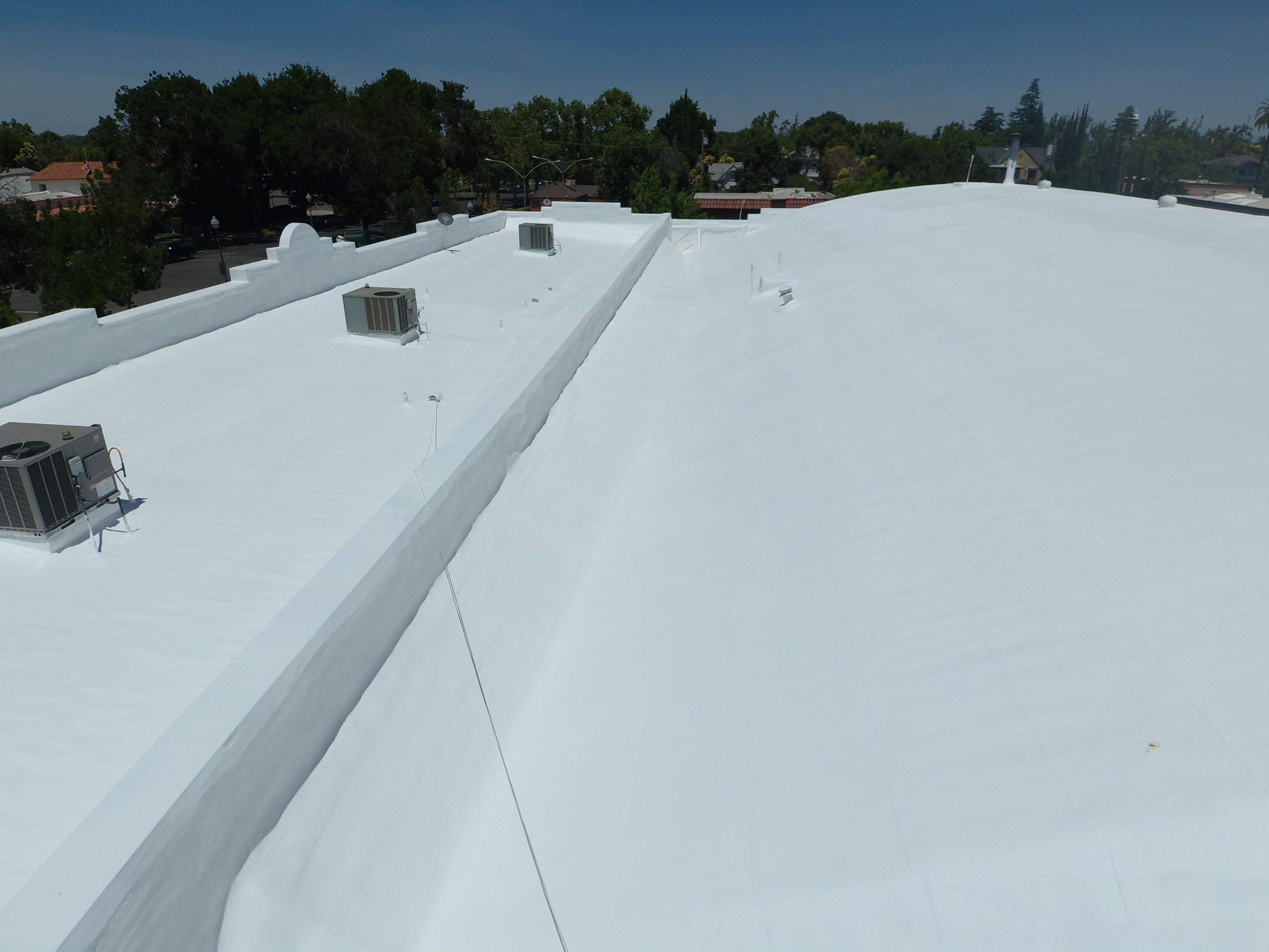 Spray foam and coatings using Conklin Benchmark/PUMA XL coatings and spray foam by Straight Edge Roofing Inc