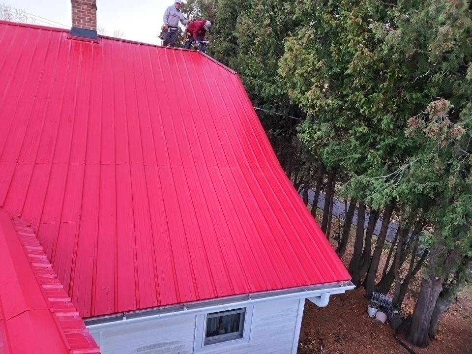 Residential Roof Installation with Red Pro Rib Metal Roofing in Adell, WI by Gellings Roofing and Siding LLC