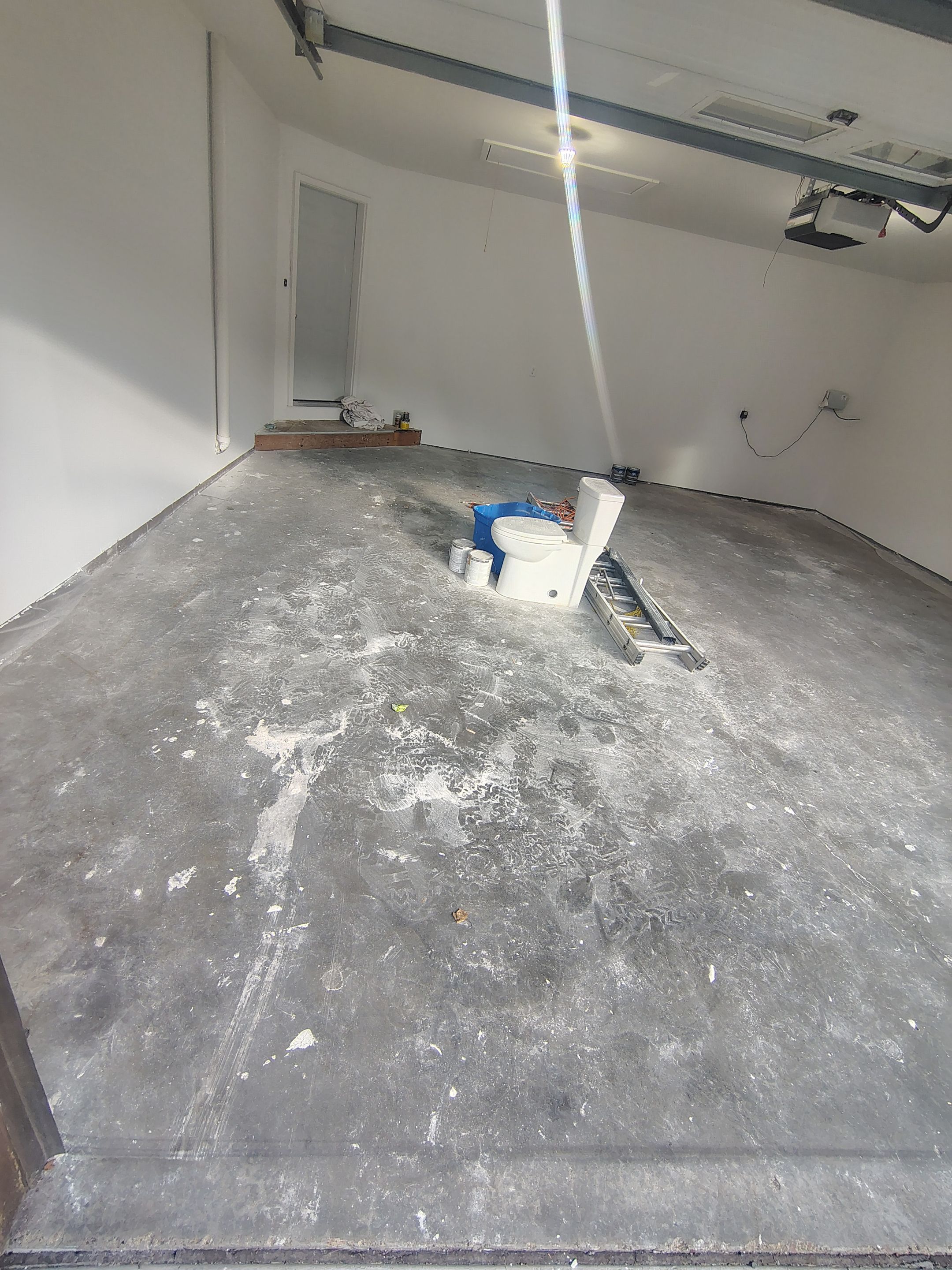 Sioux Falls Garage Floor Coating with Speckled Flake Finish by Select Painting, Coatings & Garage Cabinets