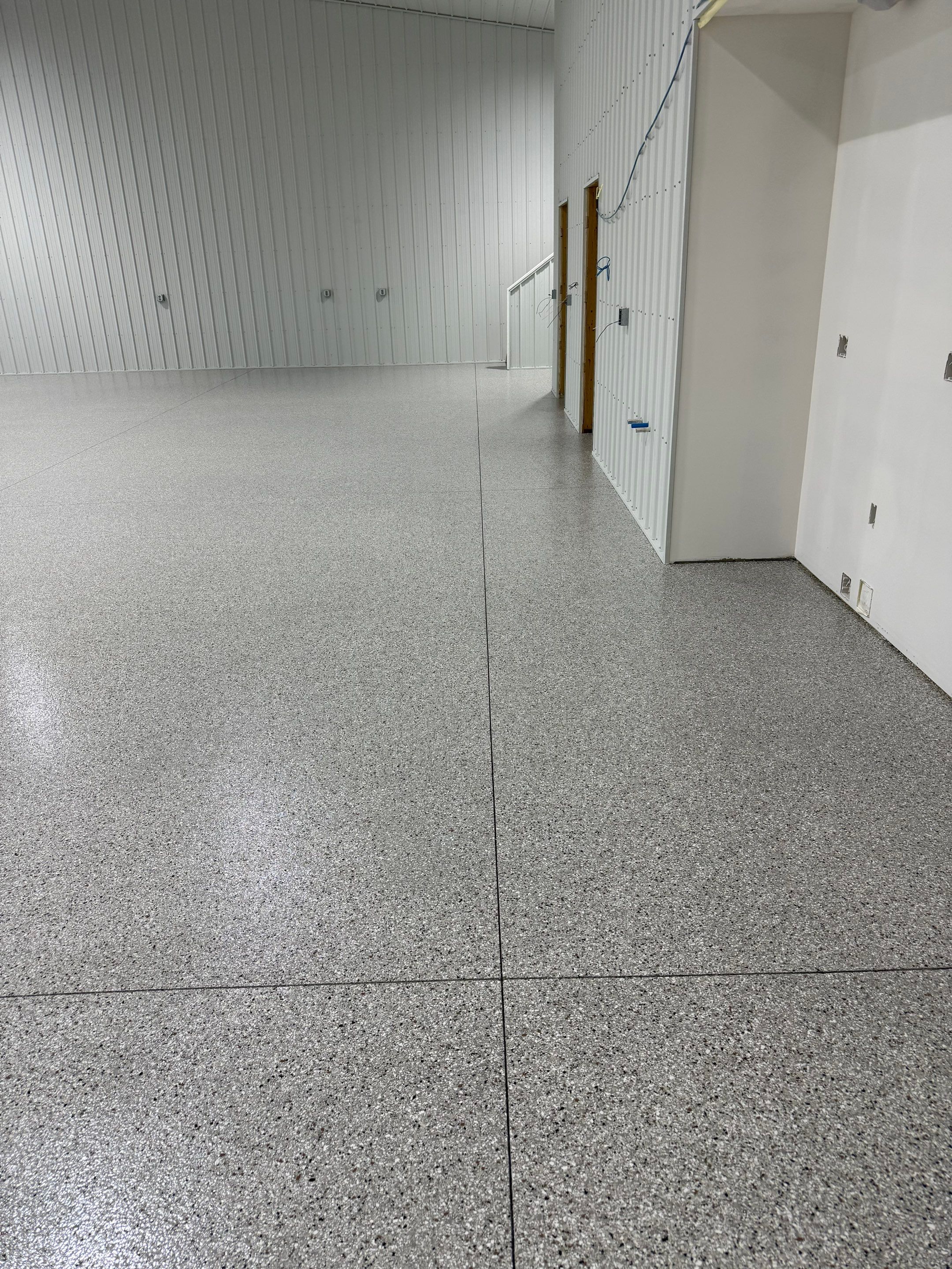 Custom Speckled Floor Coating for Large Montrose Shop by Select Painting, Coatings & Garage Cabinets