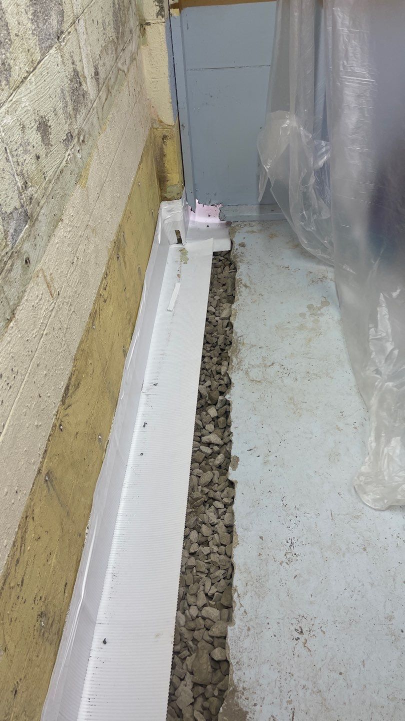 Interior Waterproofing Using GrateDrain™ Products by Toledo Basement Repair 